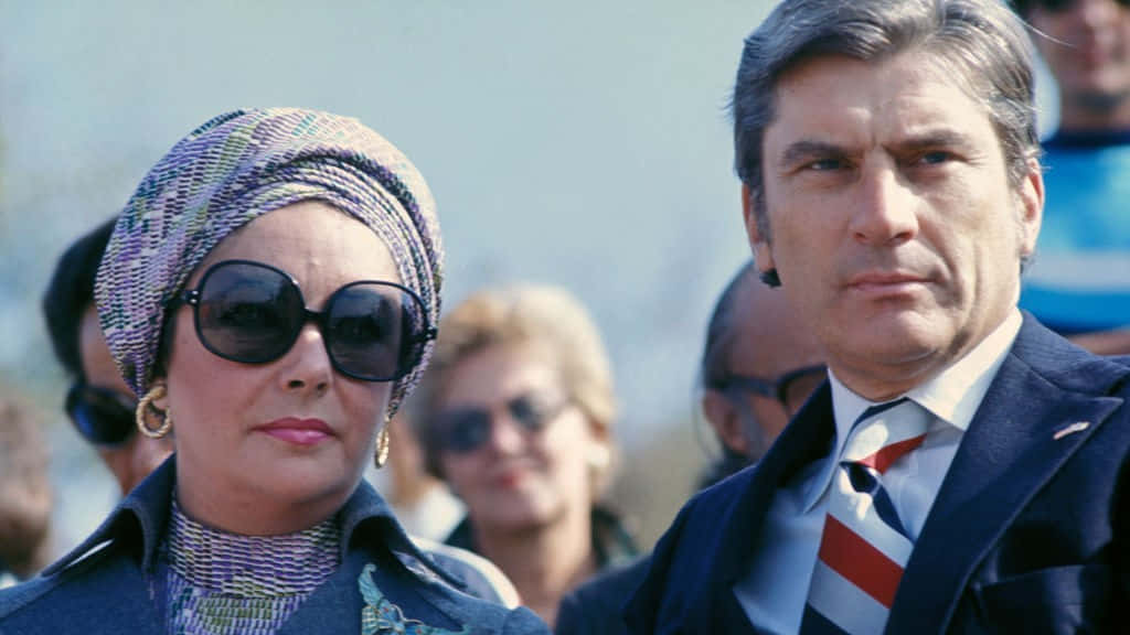 Elizabeth Taylor And John Warner In The 70s Background