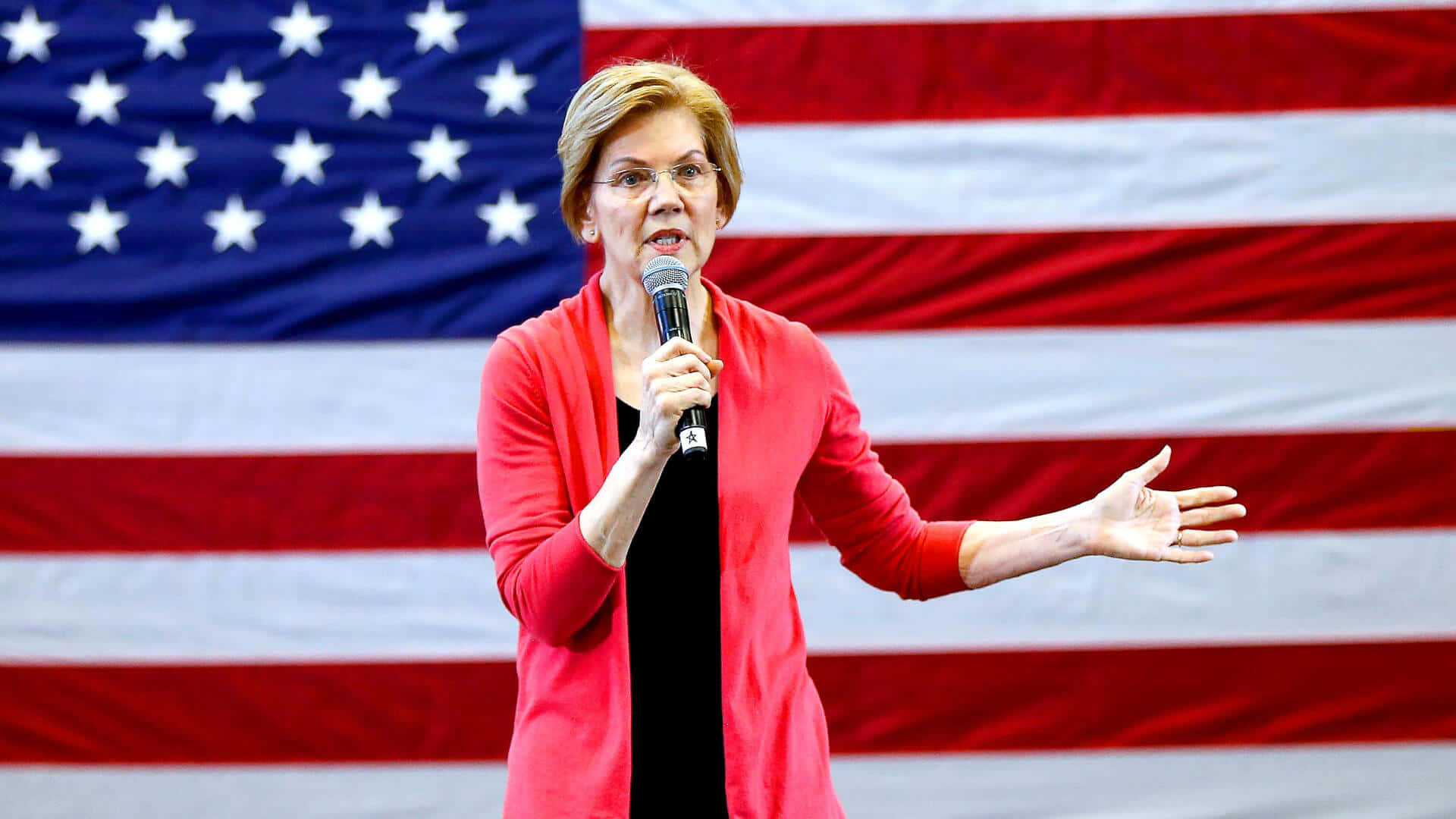 Elizabeth Warren In A Bold Red And Black Attire Background