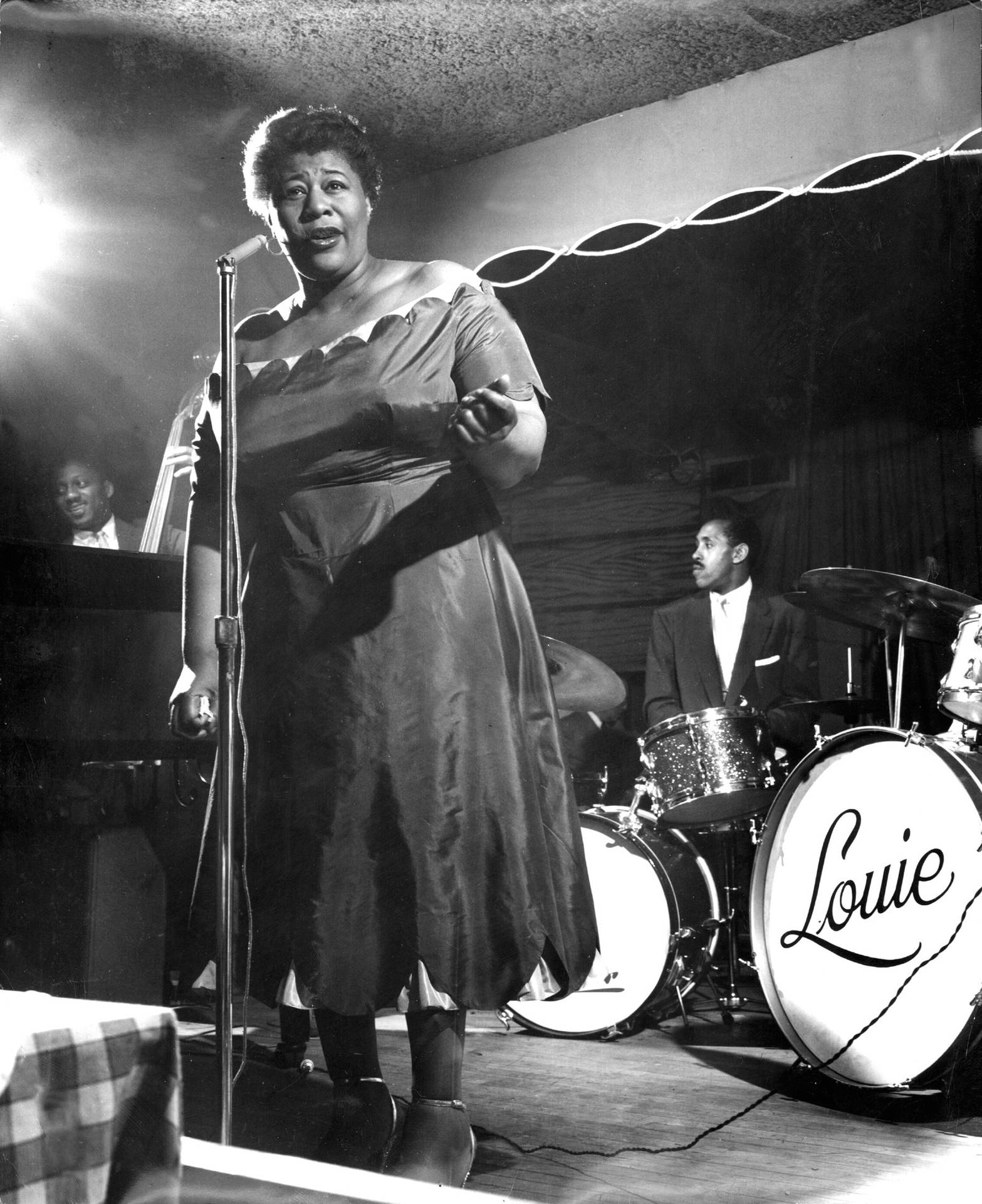 Ella Fitzgerald On Stage With Band Background