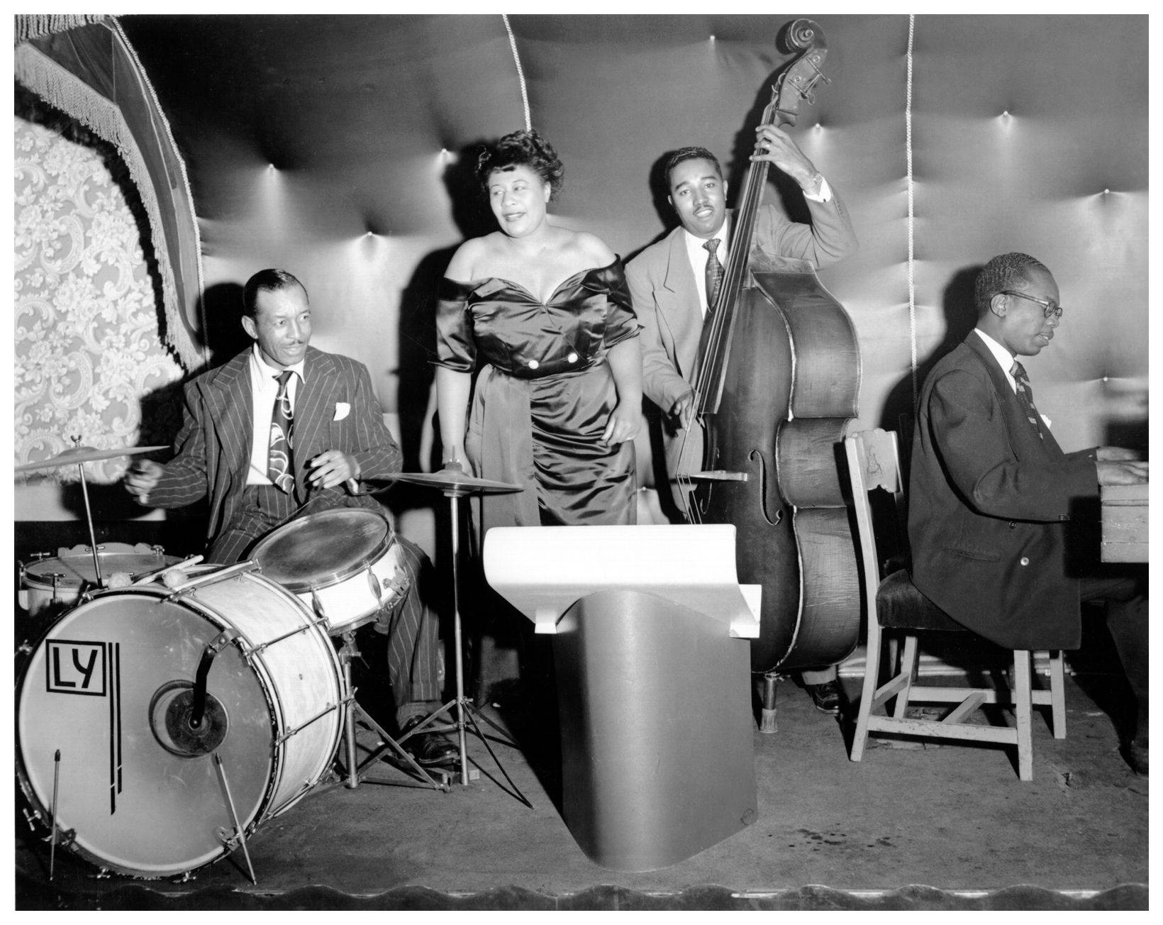 Ella Fitzgerald Onstage With Band Background