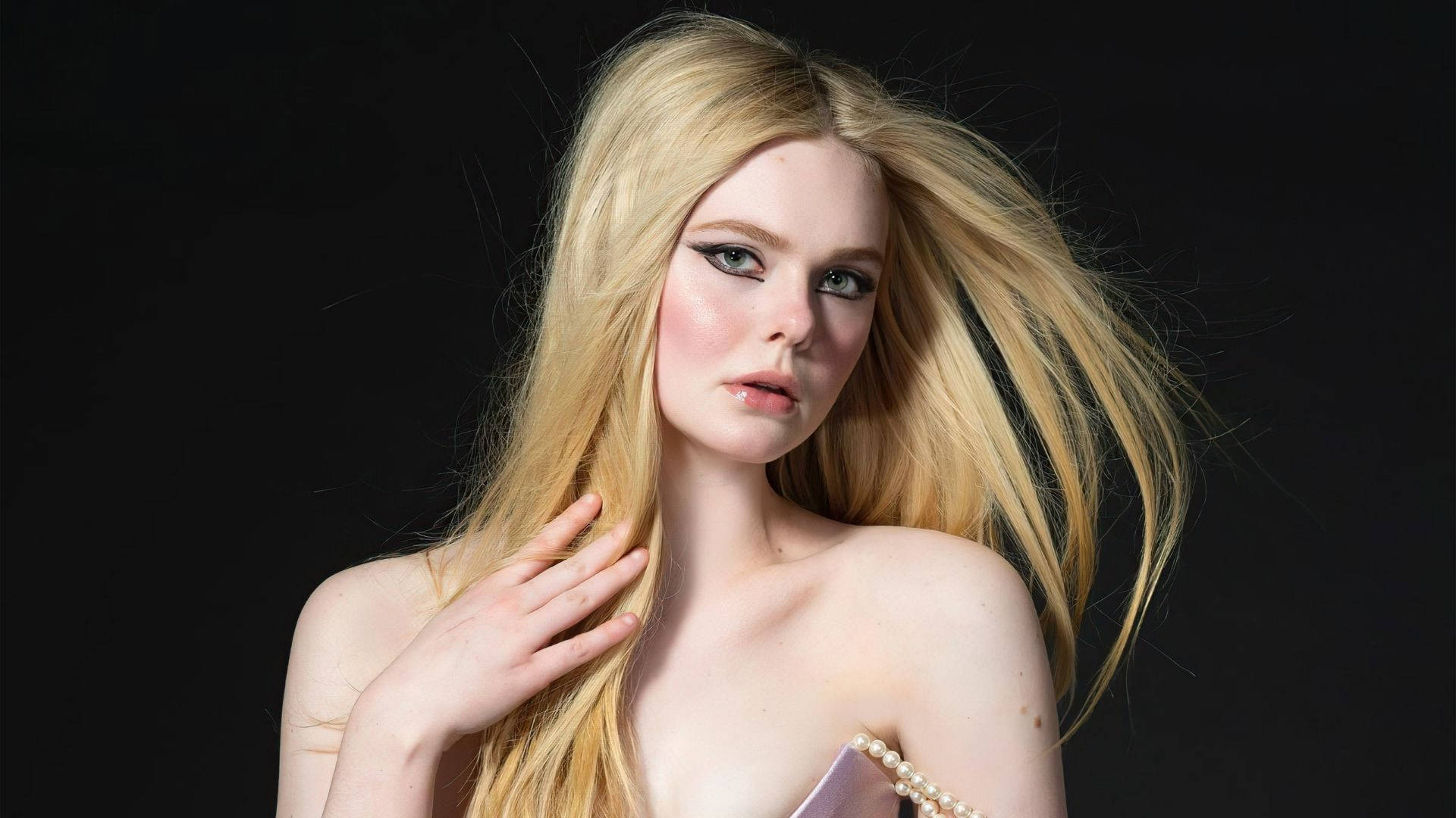 Elle Fanning Displays An Intense And Fierce Look In A Stunning Setting. Background