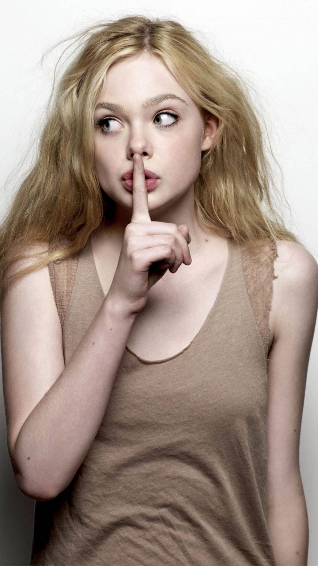 Elle Fanning Glows With Charm, Making Hush Sign Background
