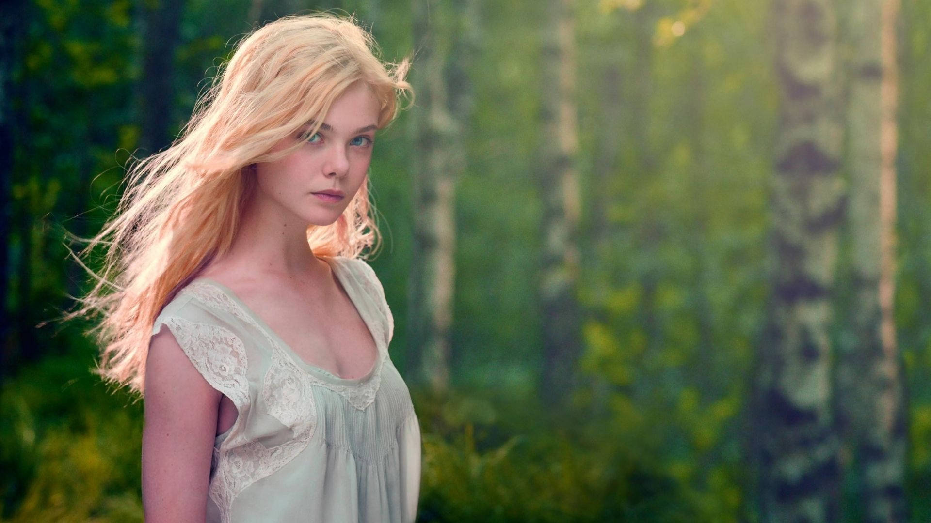 Elle Fanning In The Woods Background