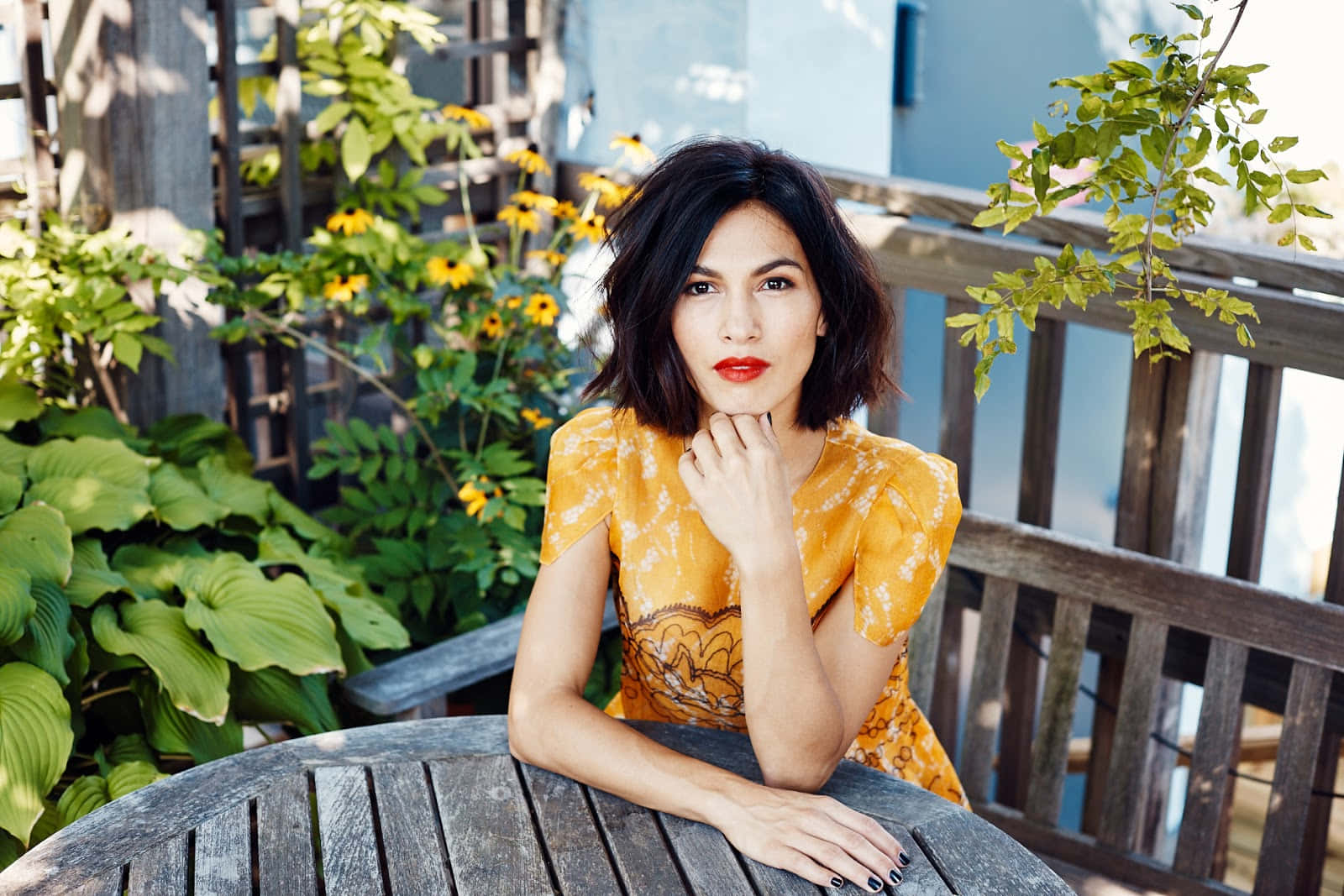 Elodie Yung Yellow Top Background