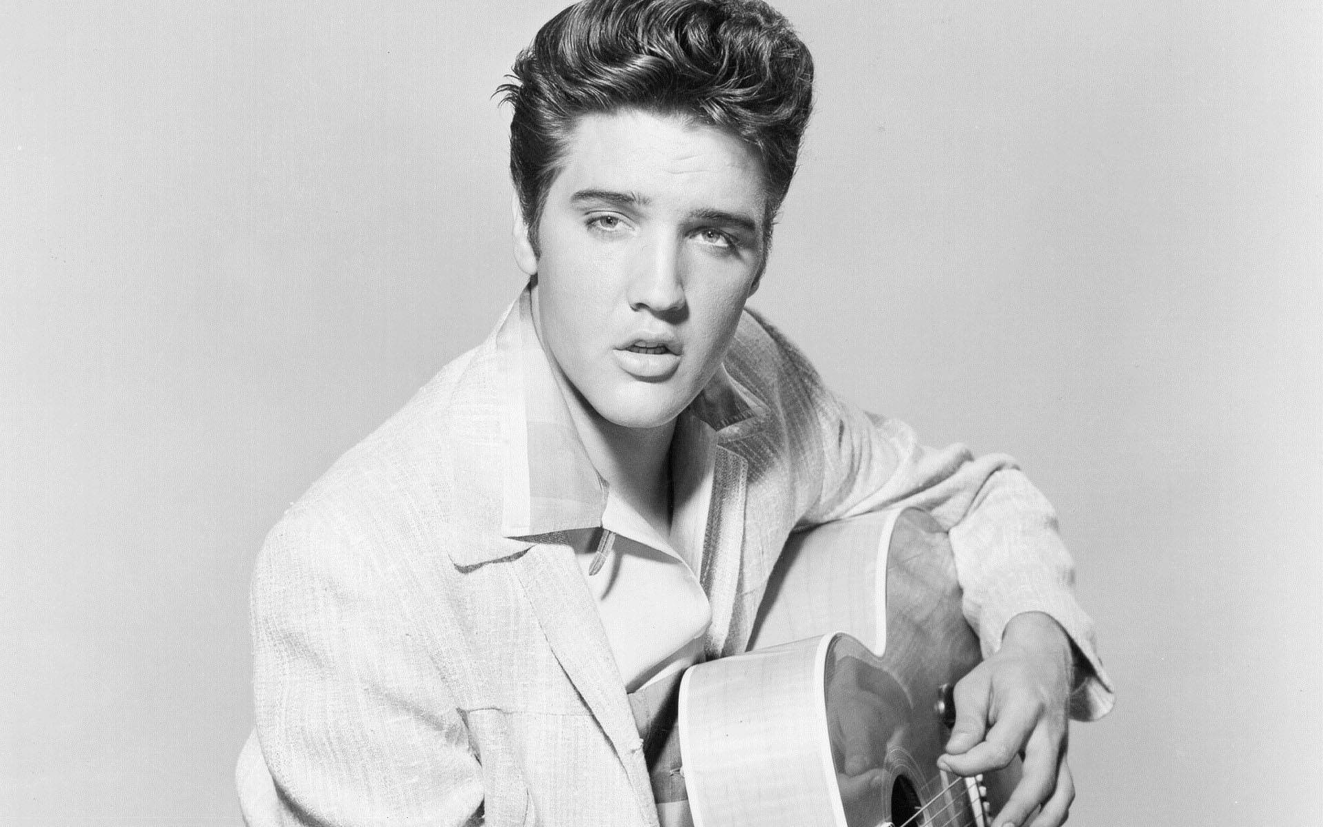 Elvis Presley With His Guitar Background