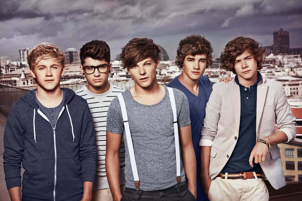 Embark On A Digital Journey With A One Direction Laptop Background