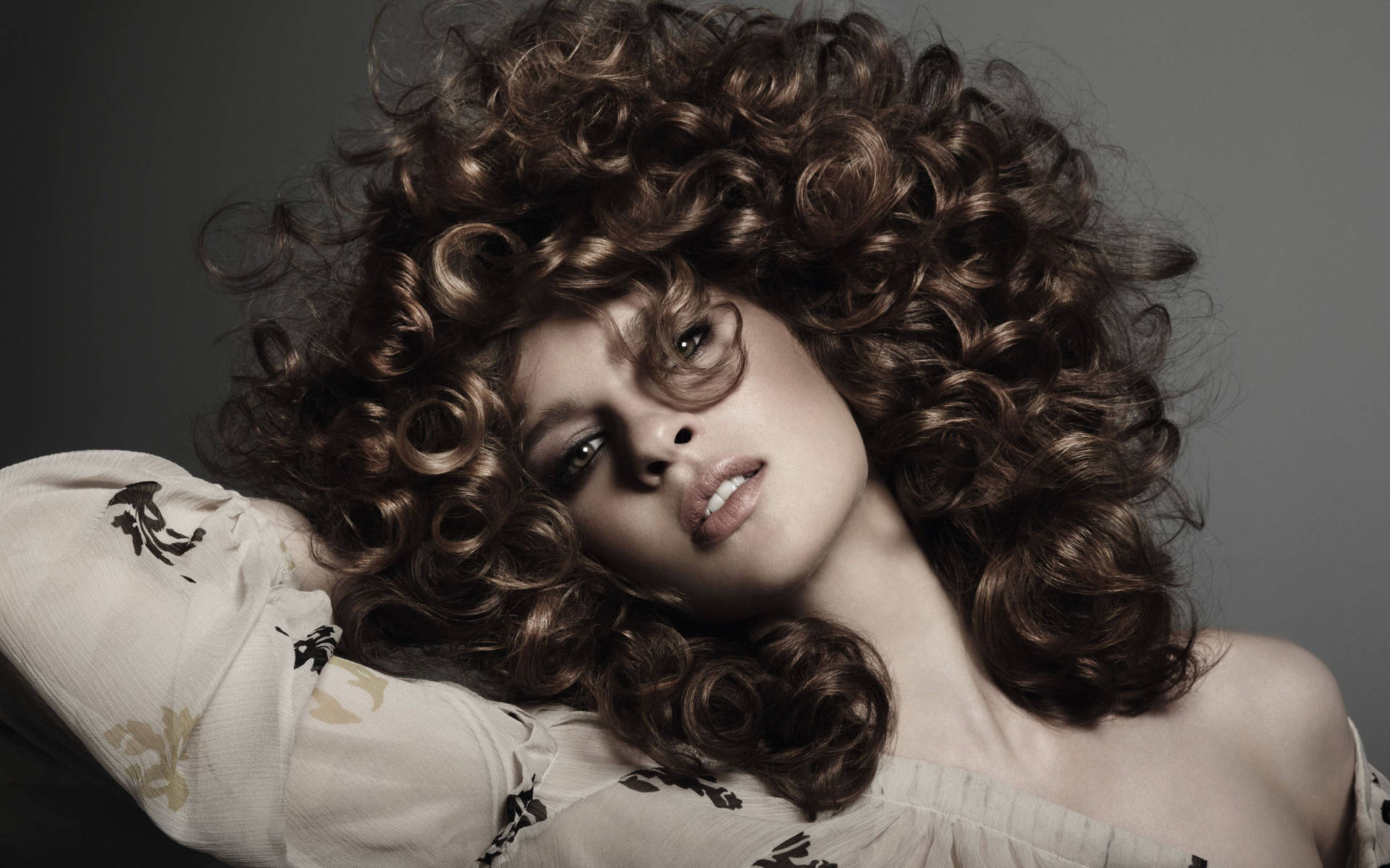 Embrace The Curl — Woman Flaunting Her Luscious Curly Hair. Background