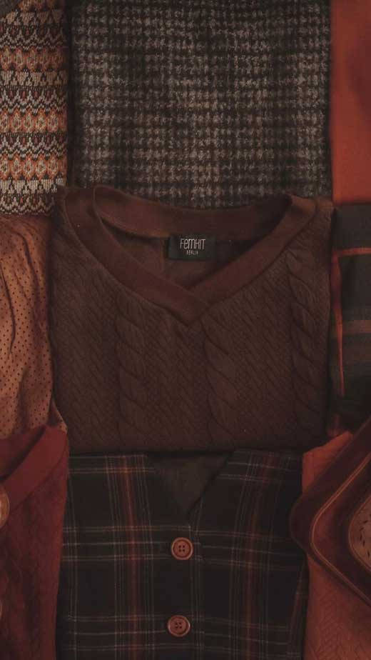 Embrace The Serenity Of Dark Brown Aesthetic Sweater Background