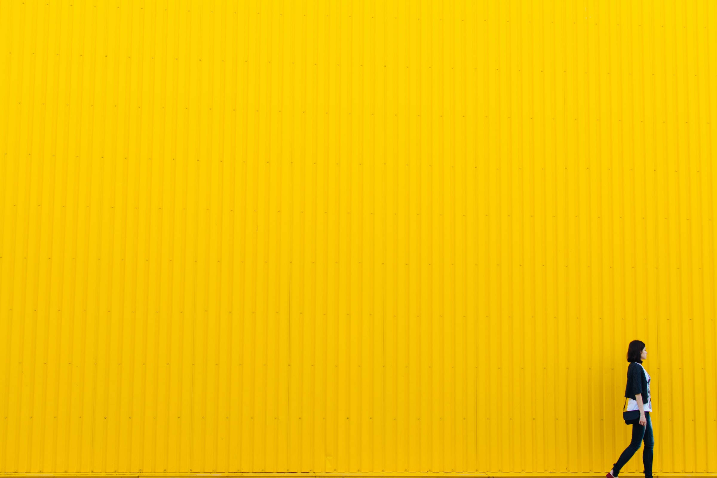 Embracing Boldness - Girl Against Yellow Wall Background