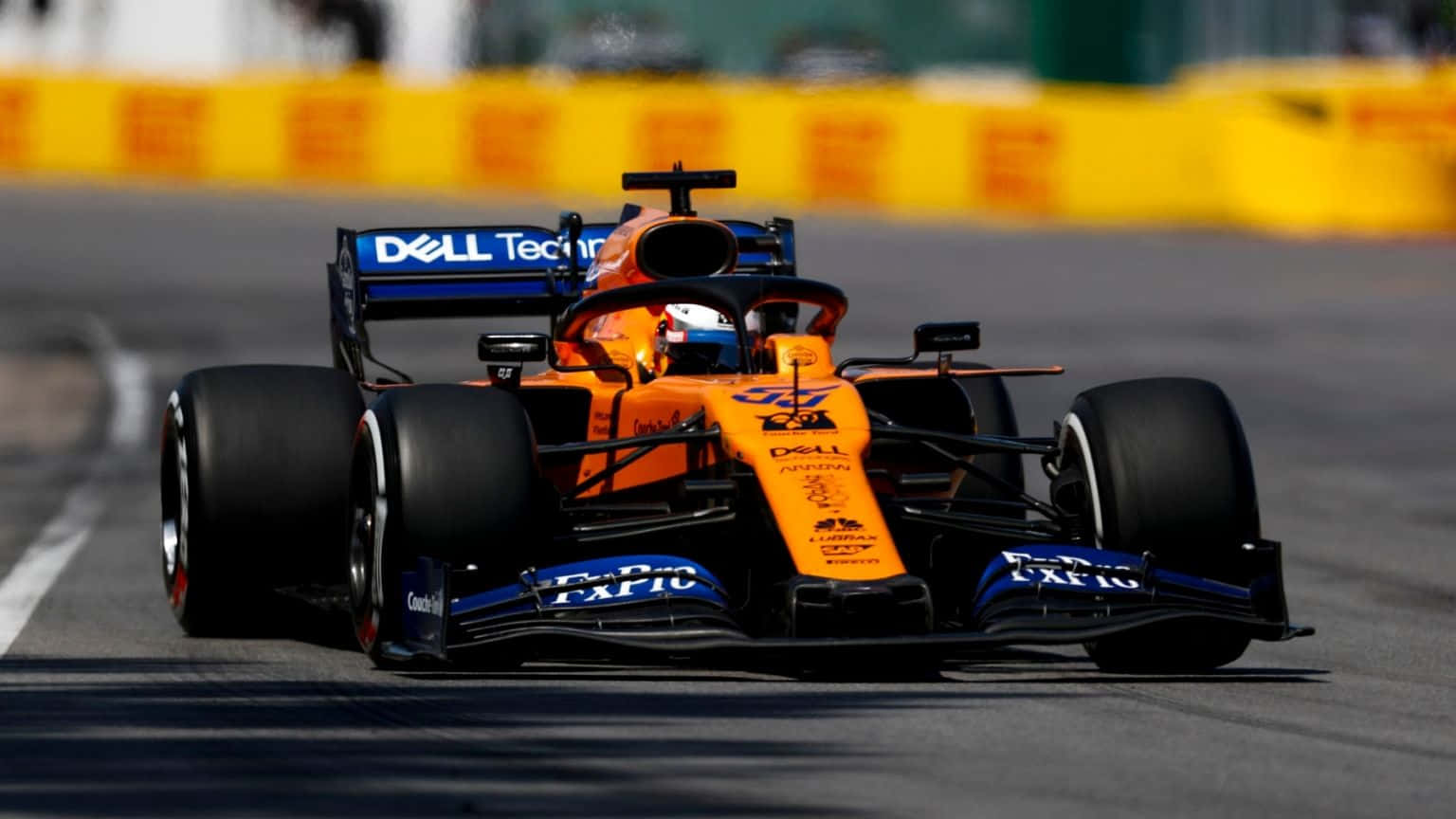 Embracing The Thrill Of Racing With Mclaren Formula 1 Background