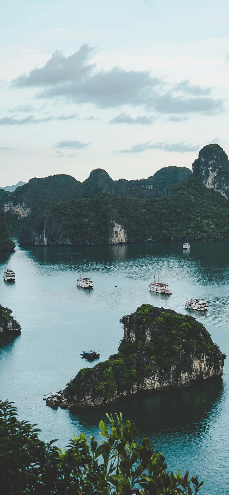 Emerald Water Of Vietnam's Halong Bay Background