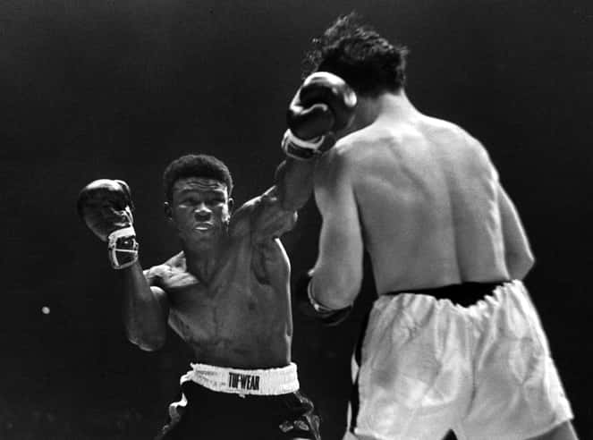 Emile Griffith In Action During Griffith Vs. Paret Boxing Match Background
