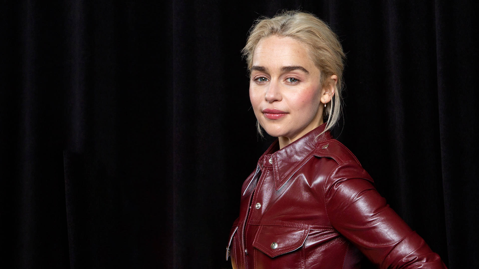 Emilia Clarke In Leather Outfit Background