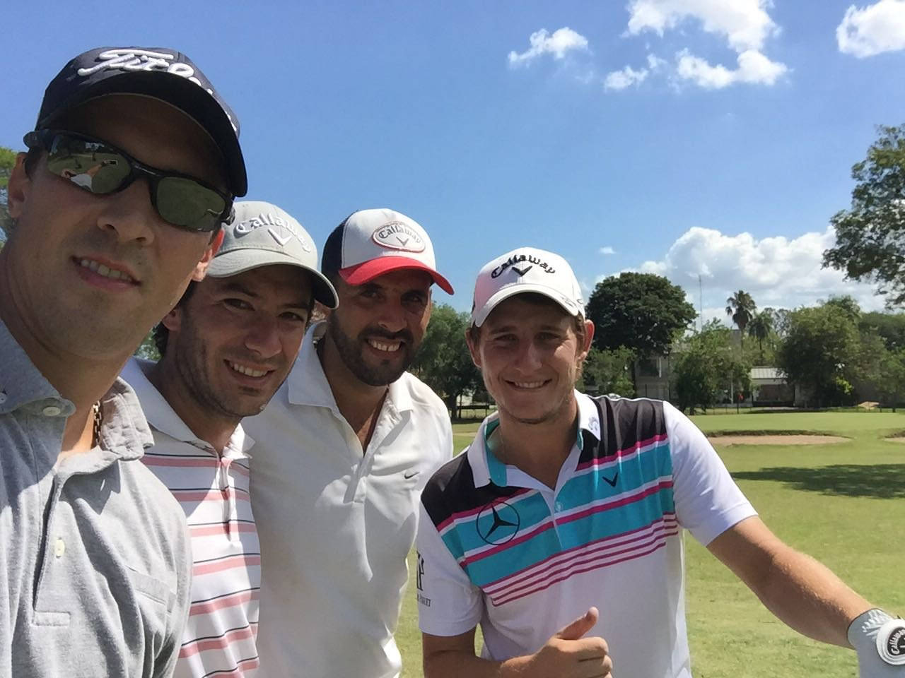 Emiliano Grillo Taking A Long Shot On The Golf Course Background