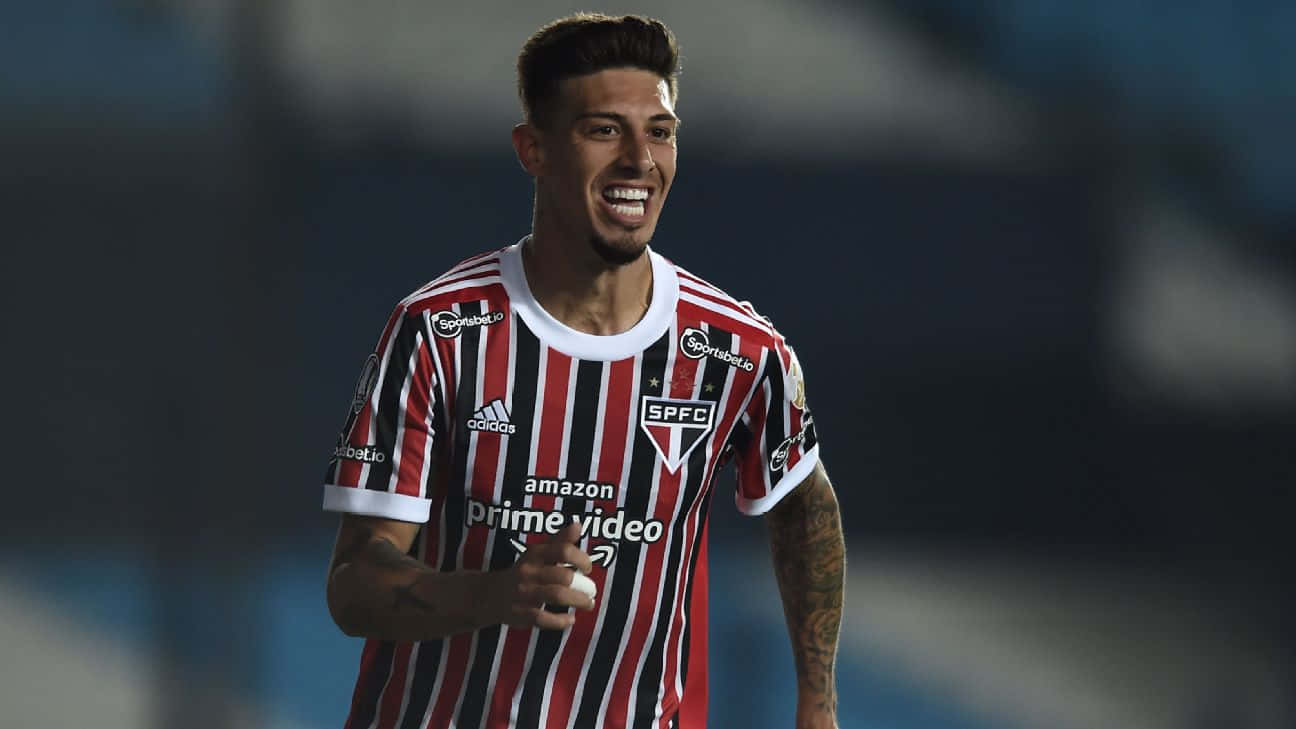 Emiliano Rigoni Soccer Player Smiling During Match Background