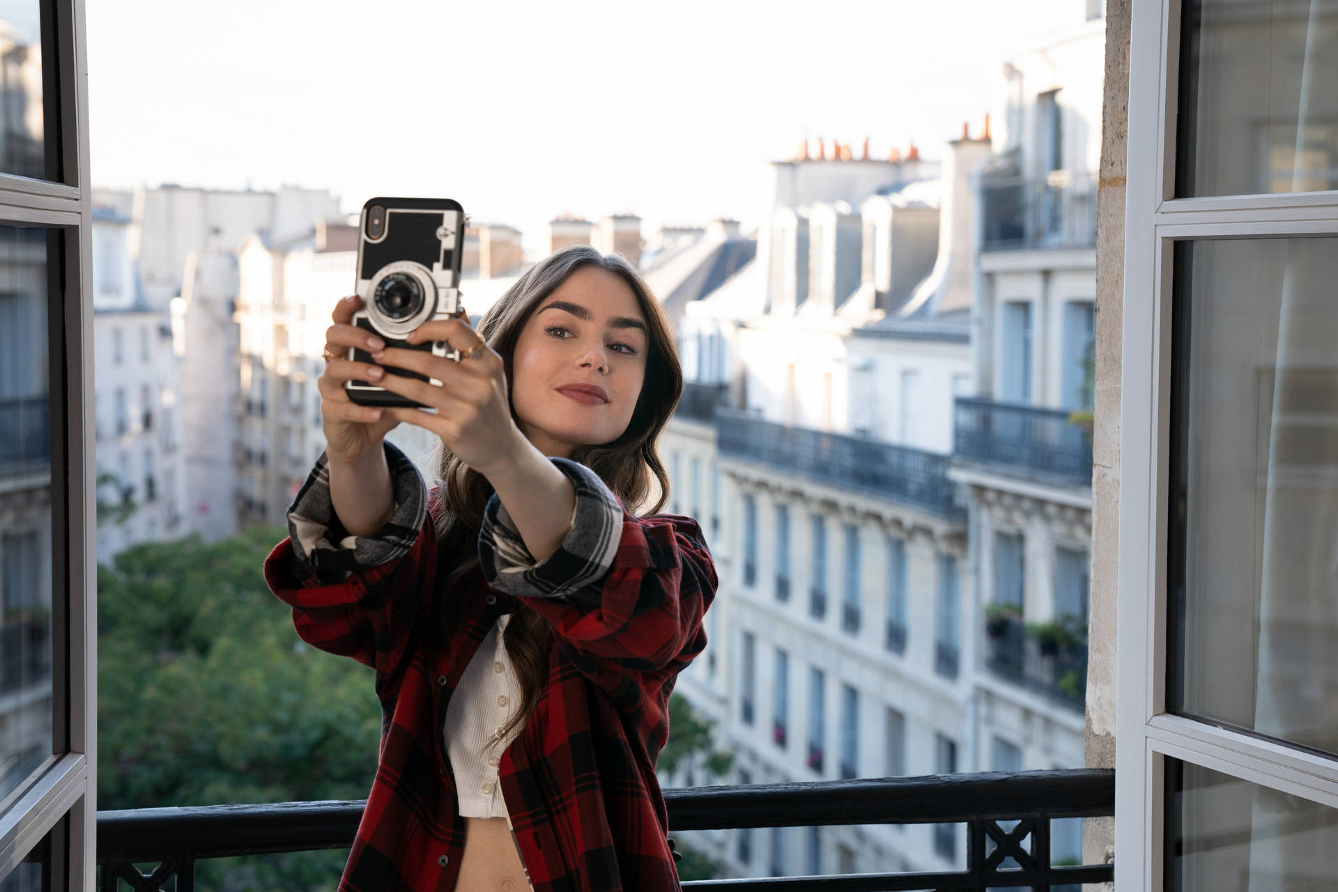 Emily In Paris Capturing Her Vacation Memories In A Selfie Background