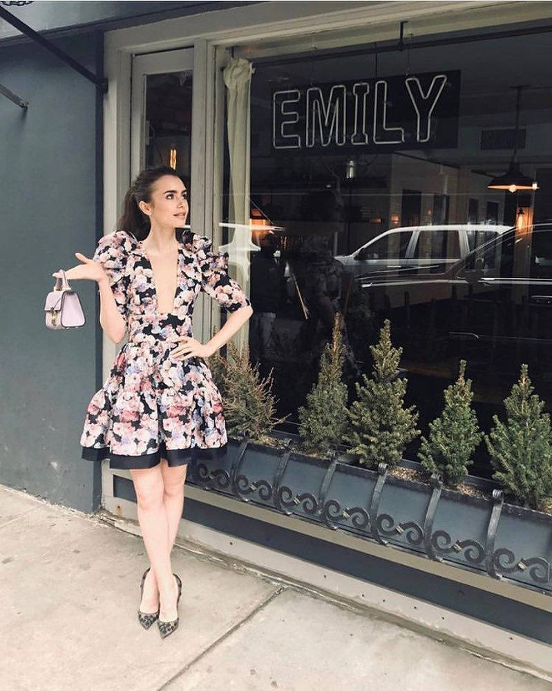 Emily In Paris Looking Pretty In Her Floral Dress Background