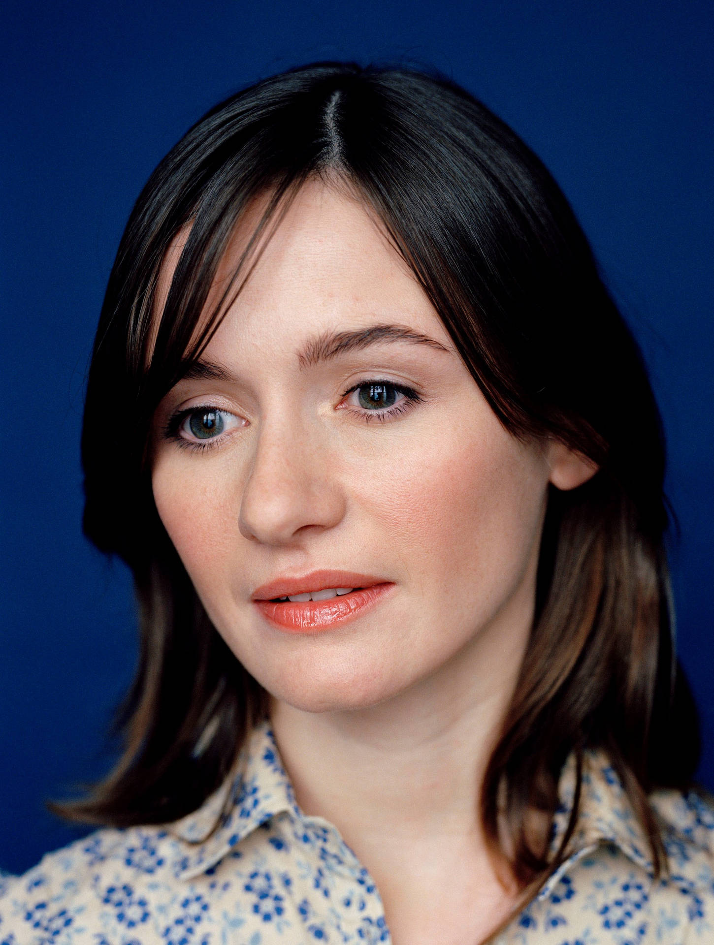 Emily Mortimer Shining In Her Blue Attire Background