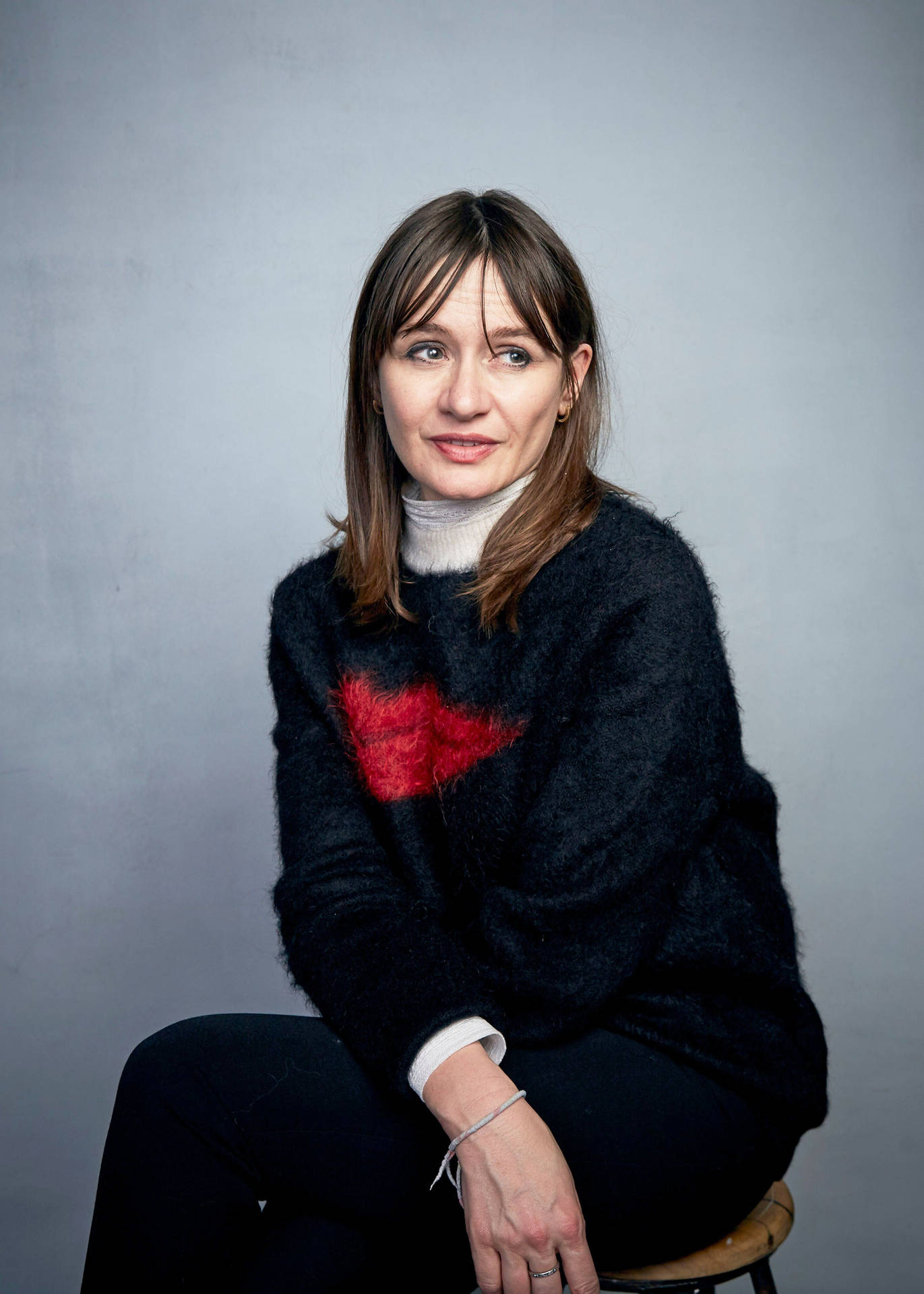 Emily Mortimer Sitting Background