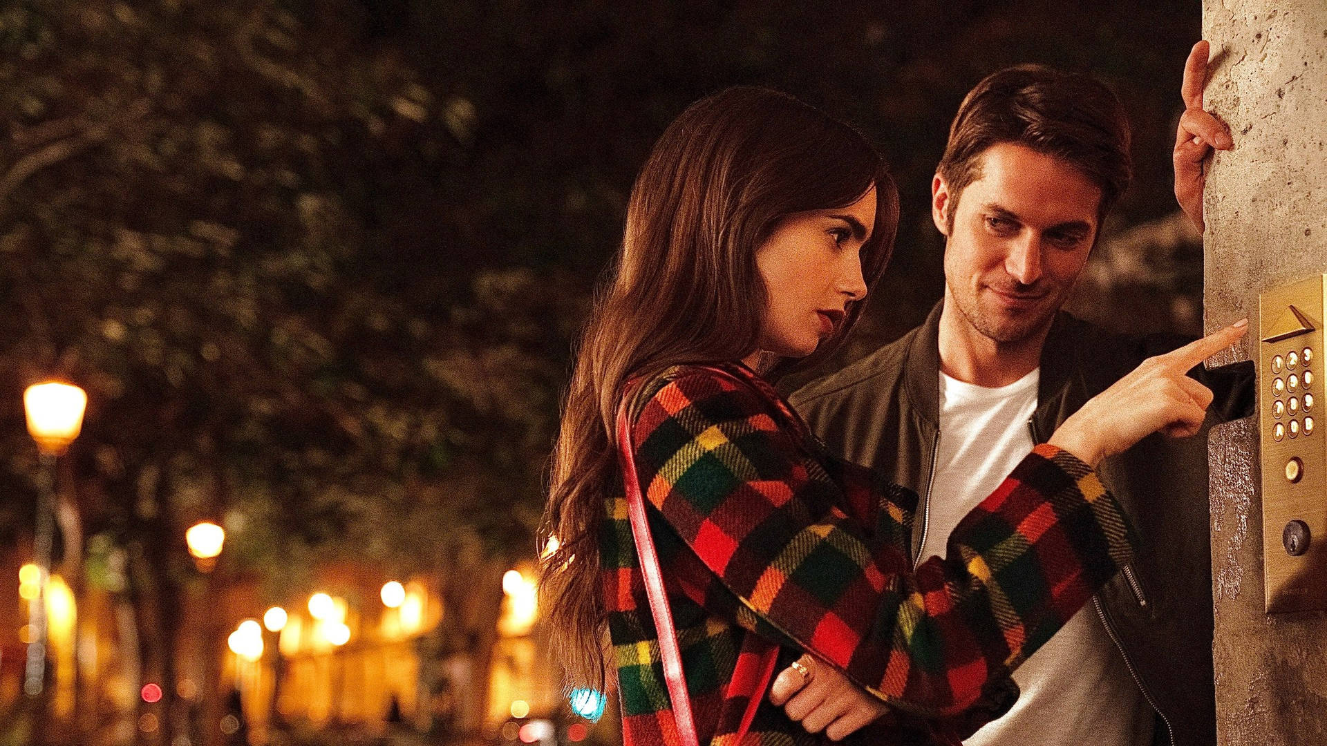 Emily, Played By Lily Collins, And Gabriel, Played By Lucas Bravo, Enjoying A Romantic Moment In Paris. Background