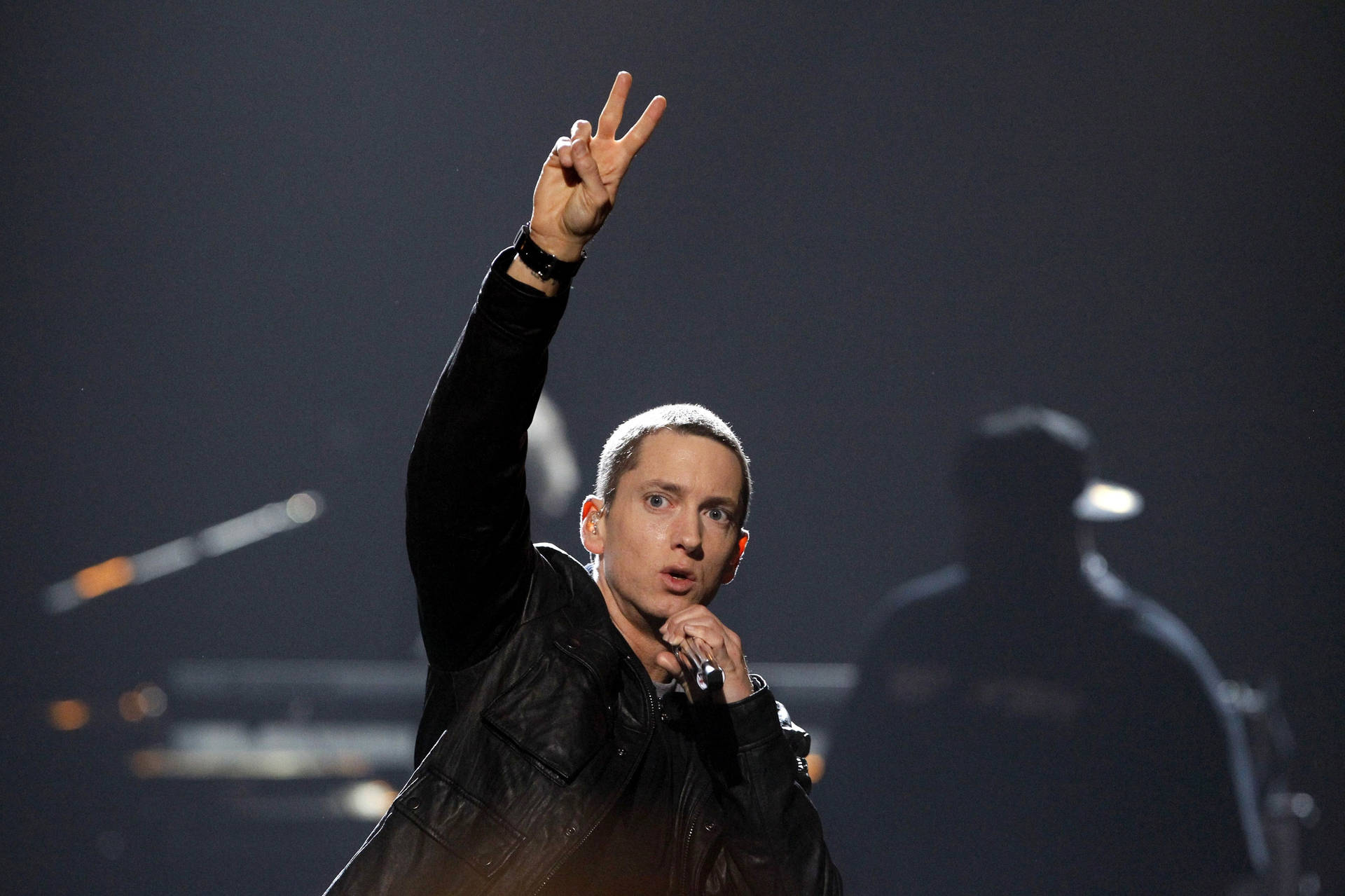 Eminem In Stage Peace Sign Background
