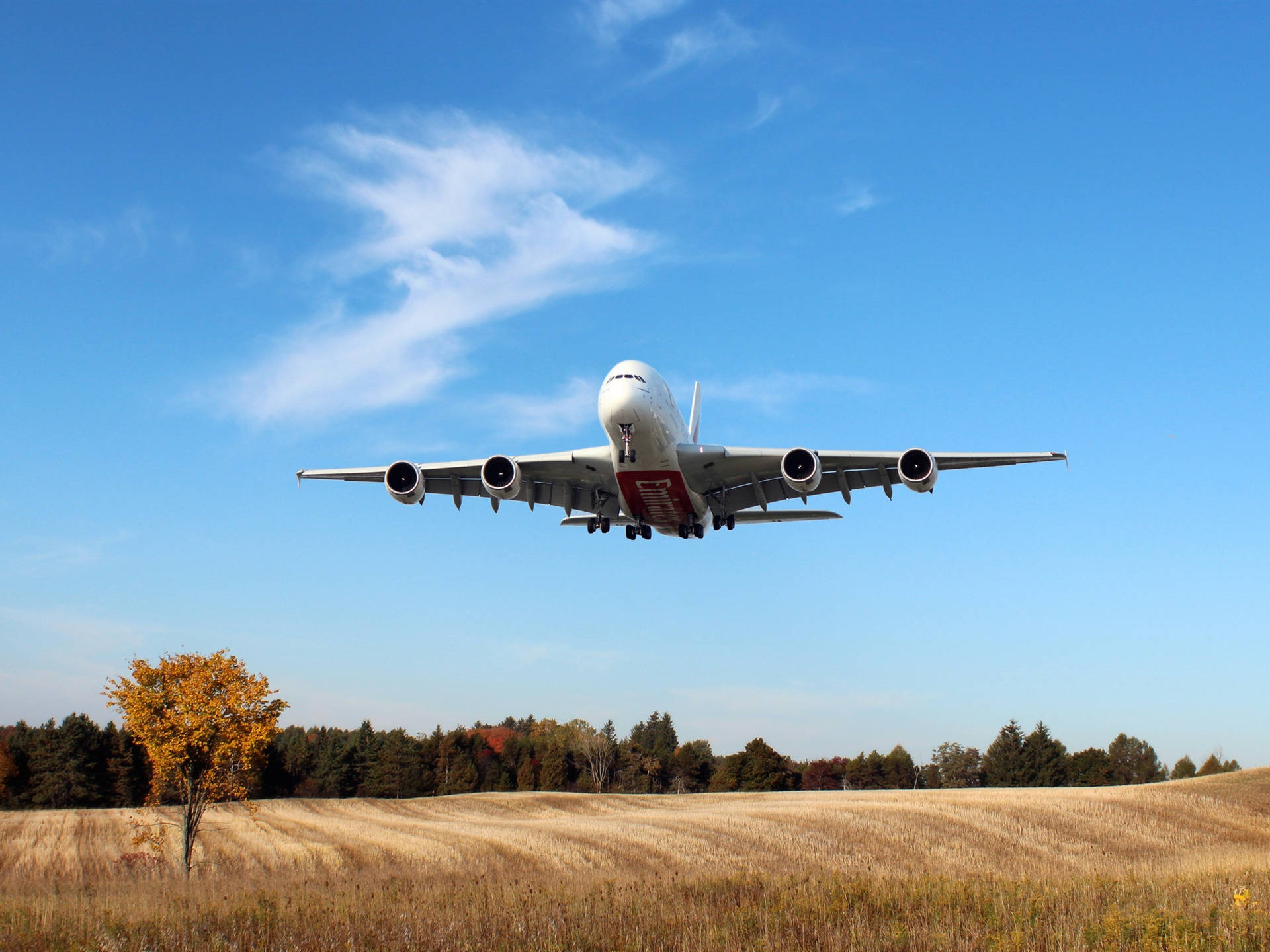 Emirates A380 Flying Over A Farm