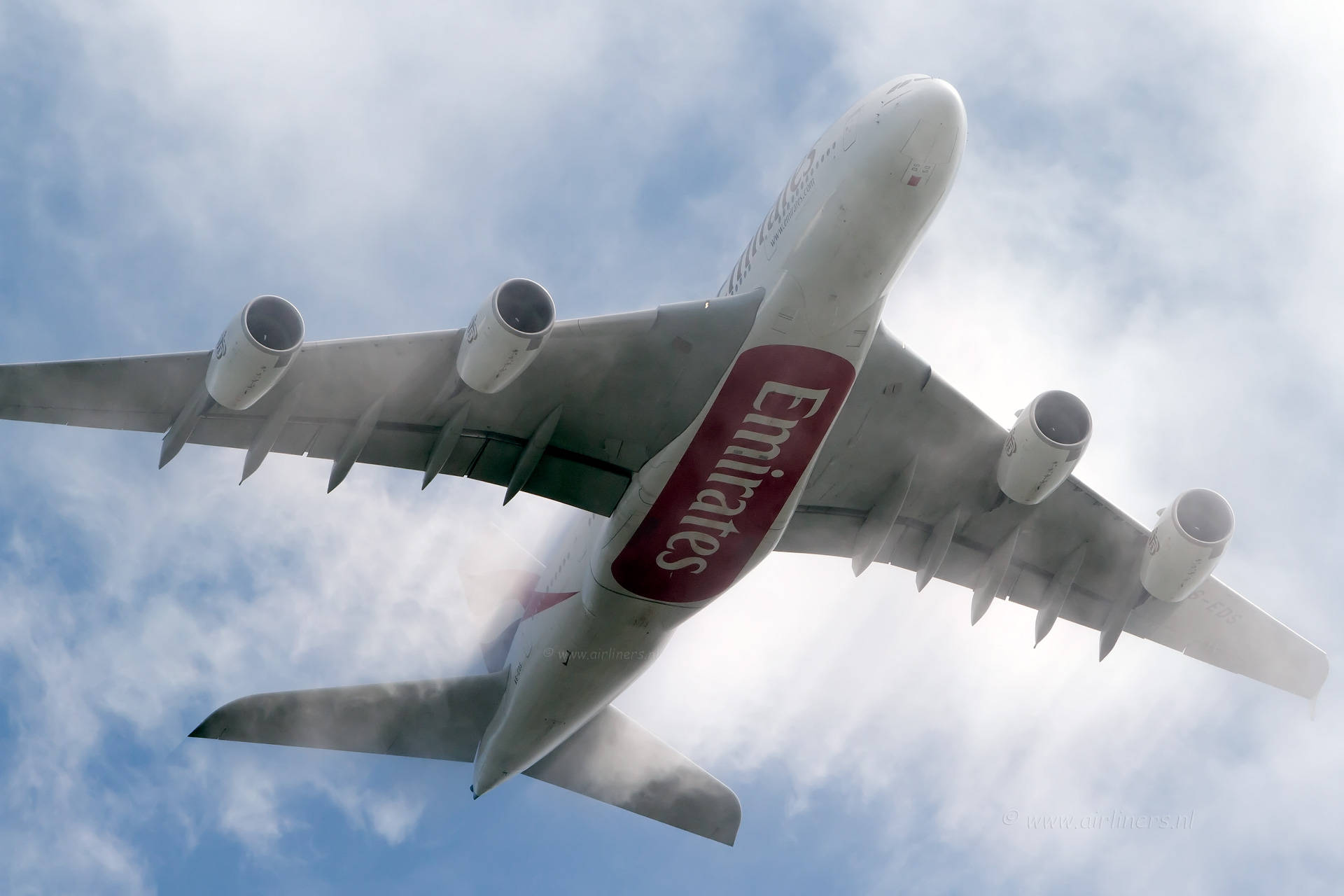 Emirates A380 Soaring In The Sky Background