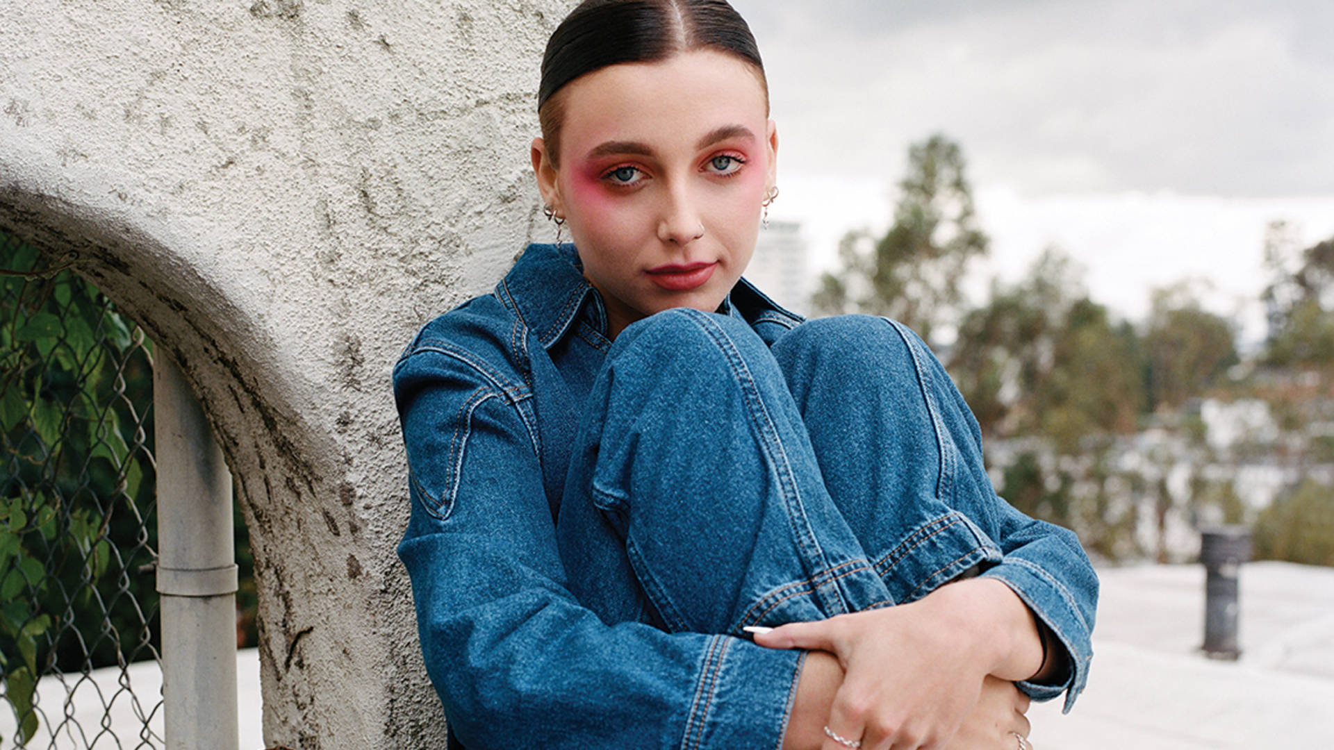Emma Chamberlain In Denim Outfit Background