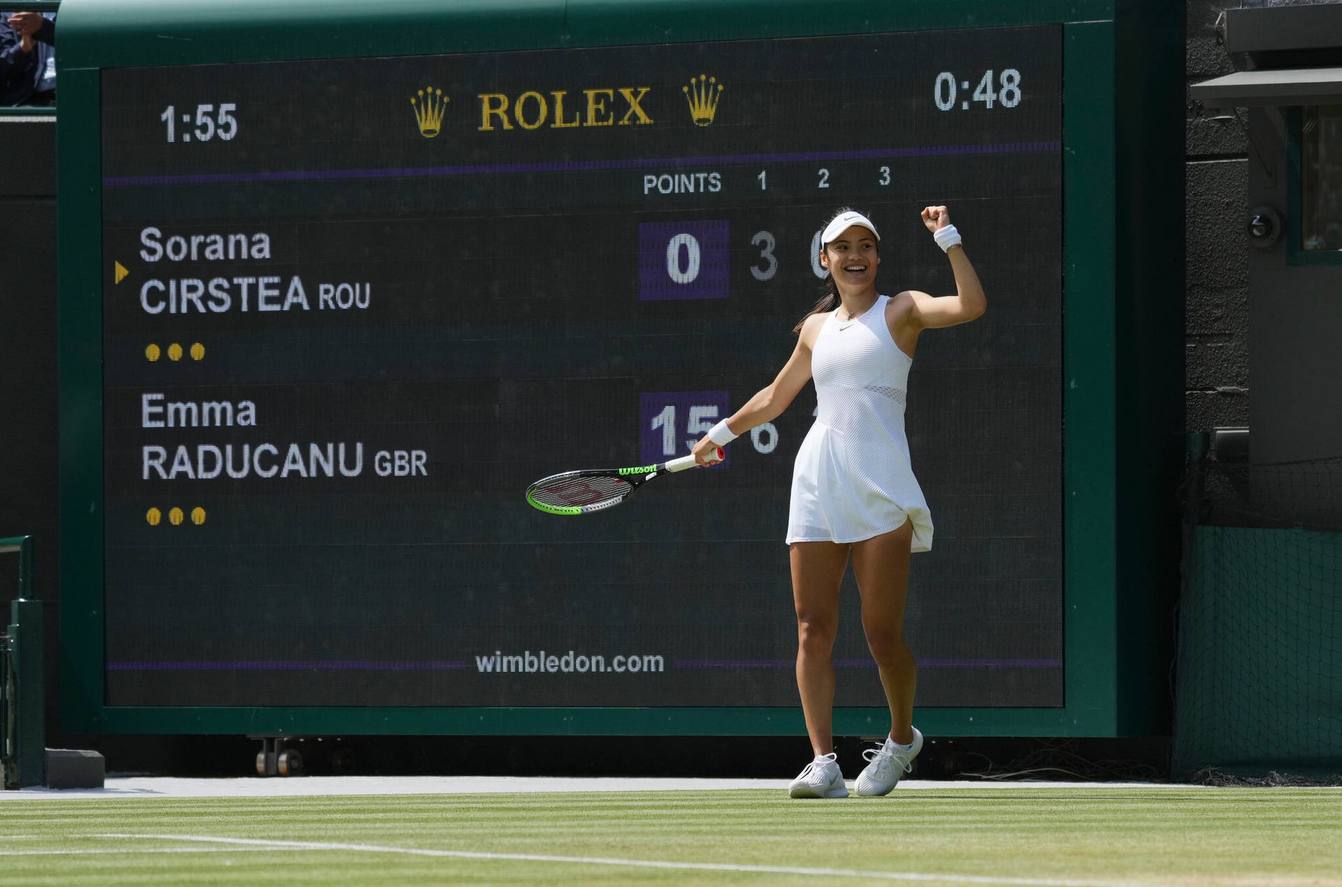 Emma Raducanu Scoring A Victory On The Tennis Court. Background