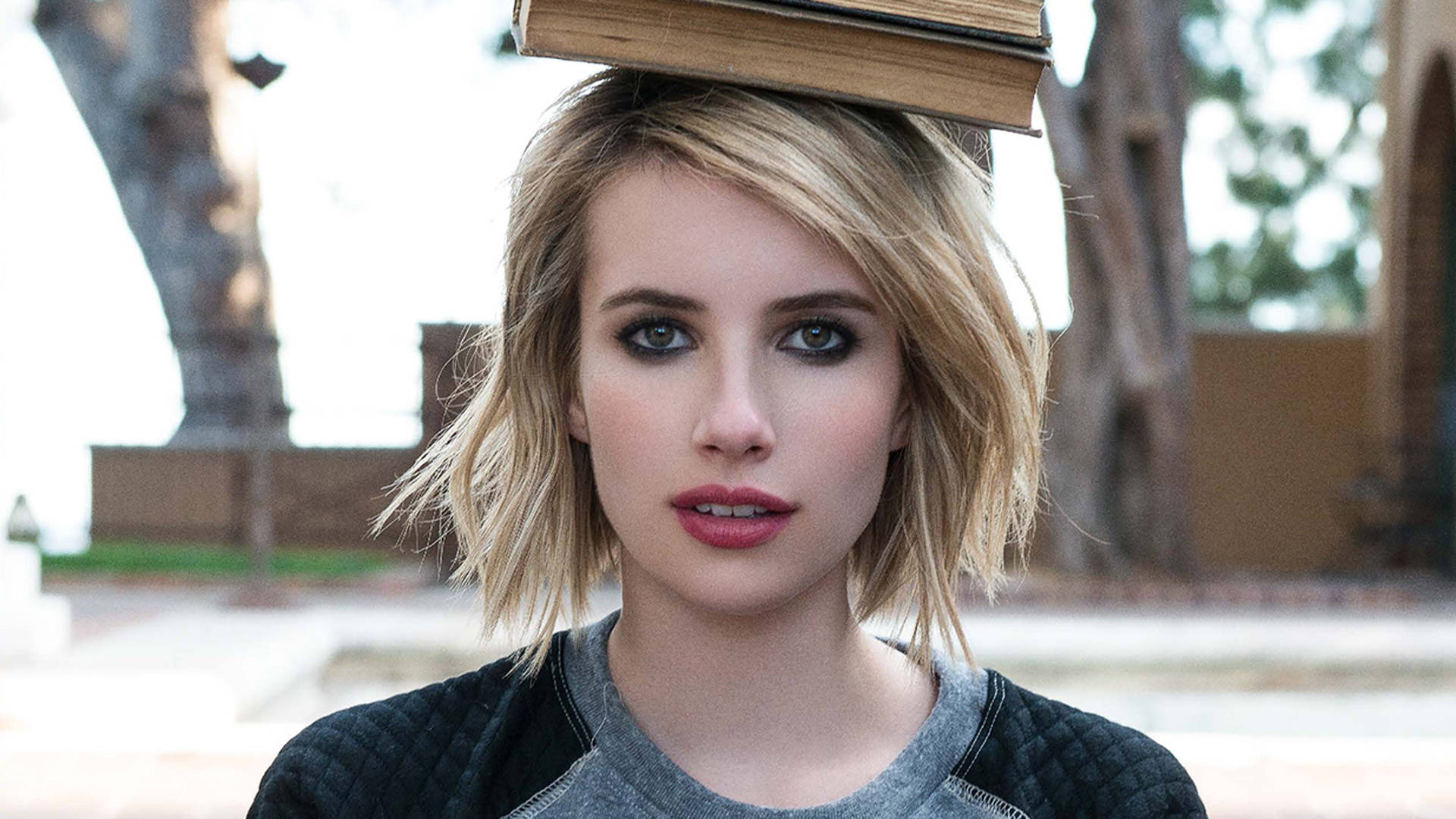 Emma Roberts Balancing A Book Background