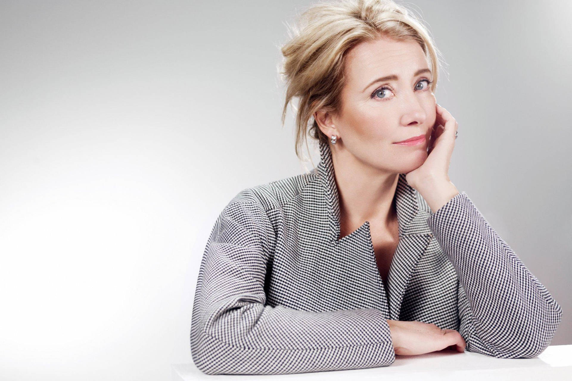 Emma Thompson With A Radiant Smile Background