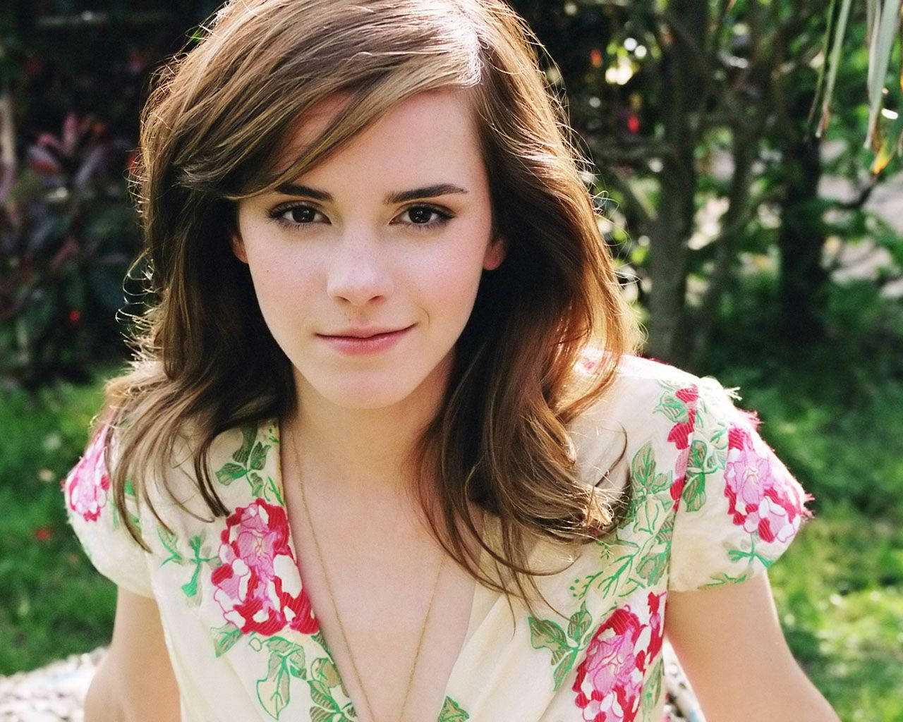 Emma Watson Channeling A Modern-day Princess In A Beautiful Floral Dress Background