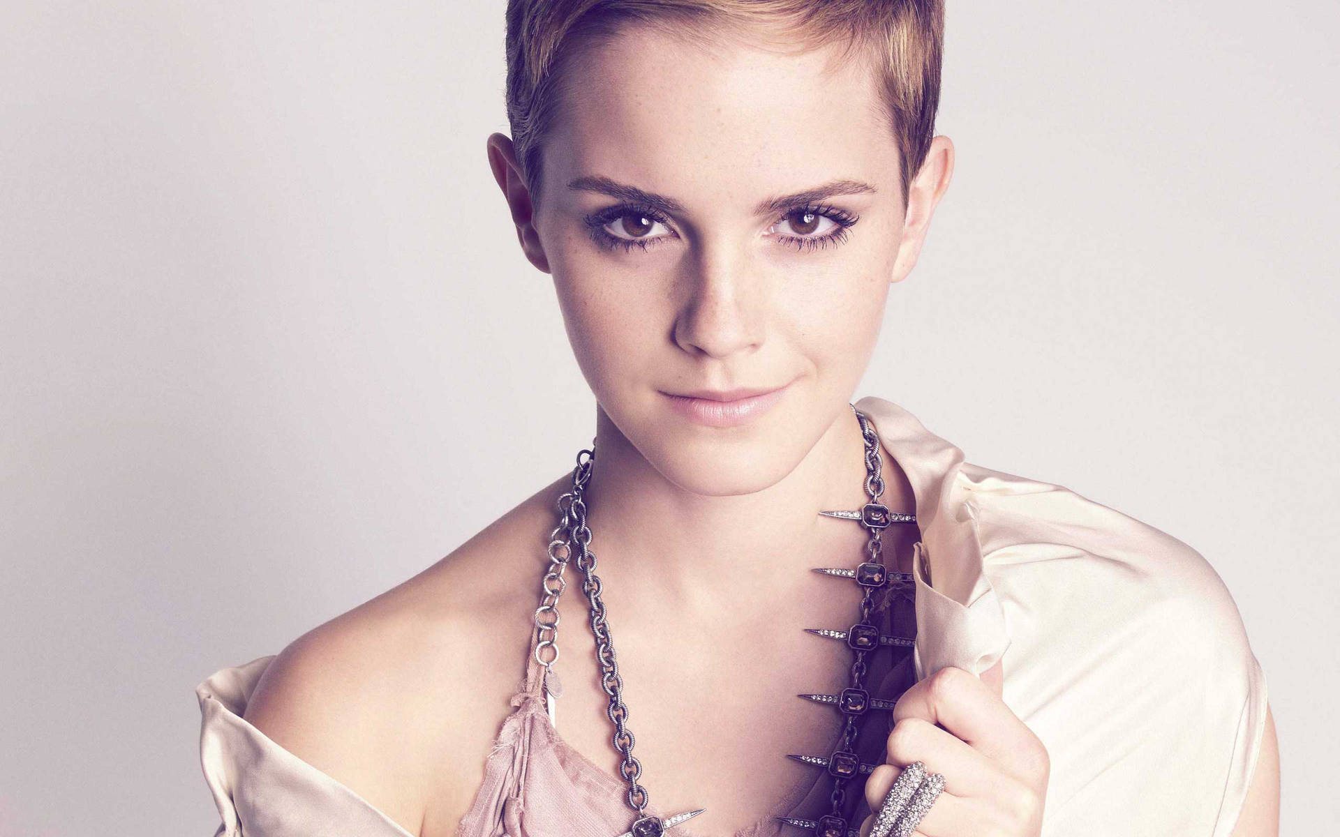 Emma Watson Debuts A New Short Hair Look Background