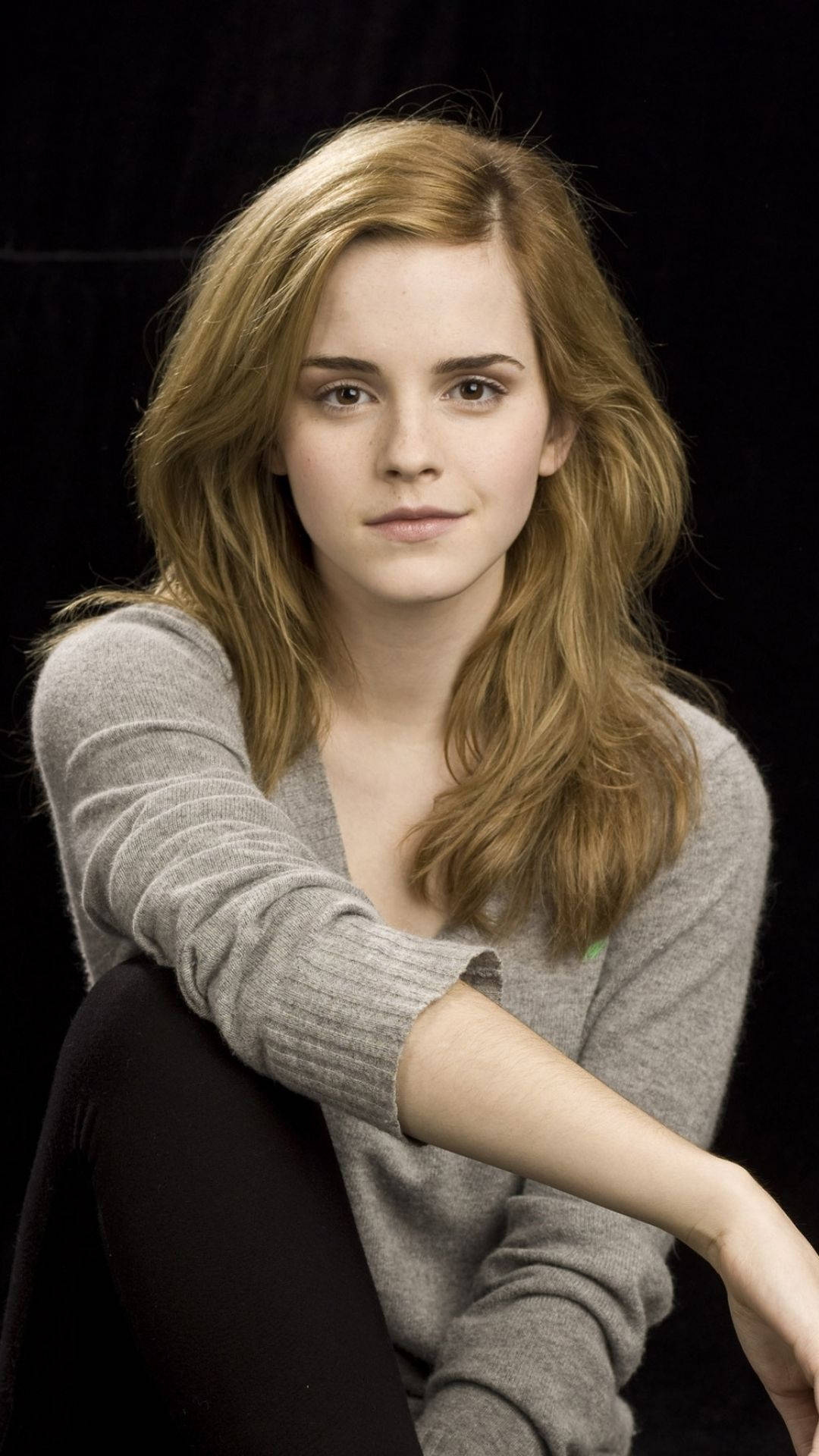 Emma Watson Looking Stylish In A Casual Setting Background