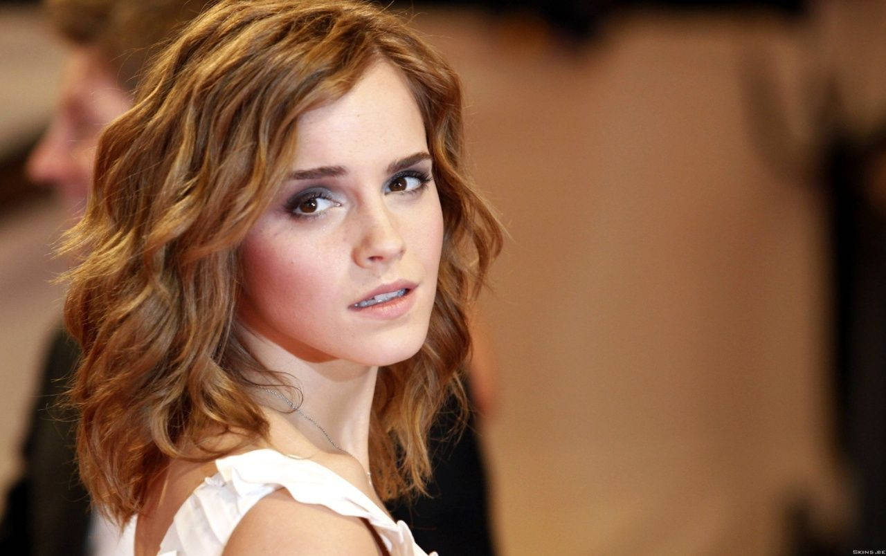Emma Watson Taking A Refreshing Glance Back Background