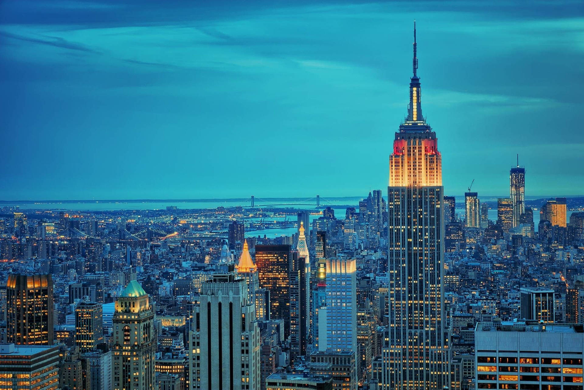 Empire State Building And New York Skyline Background