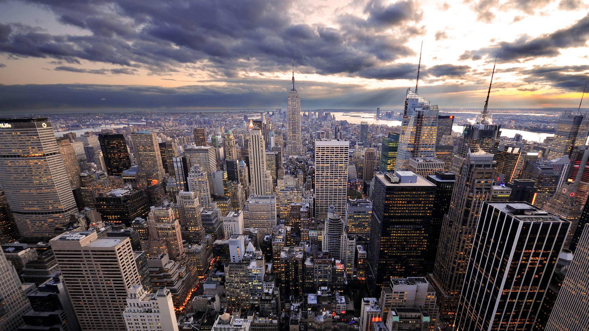 Empire State Buildings On Cloudy Sky Background