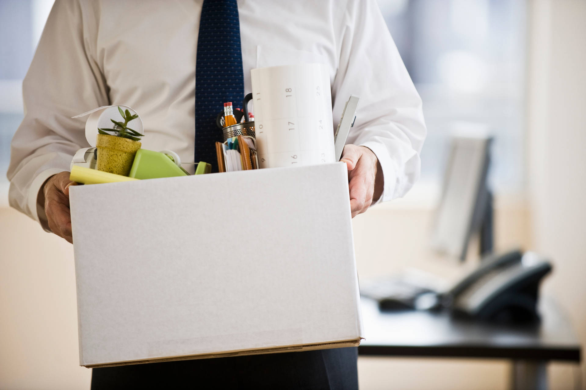 Employee Leaving Office With Belongings Background