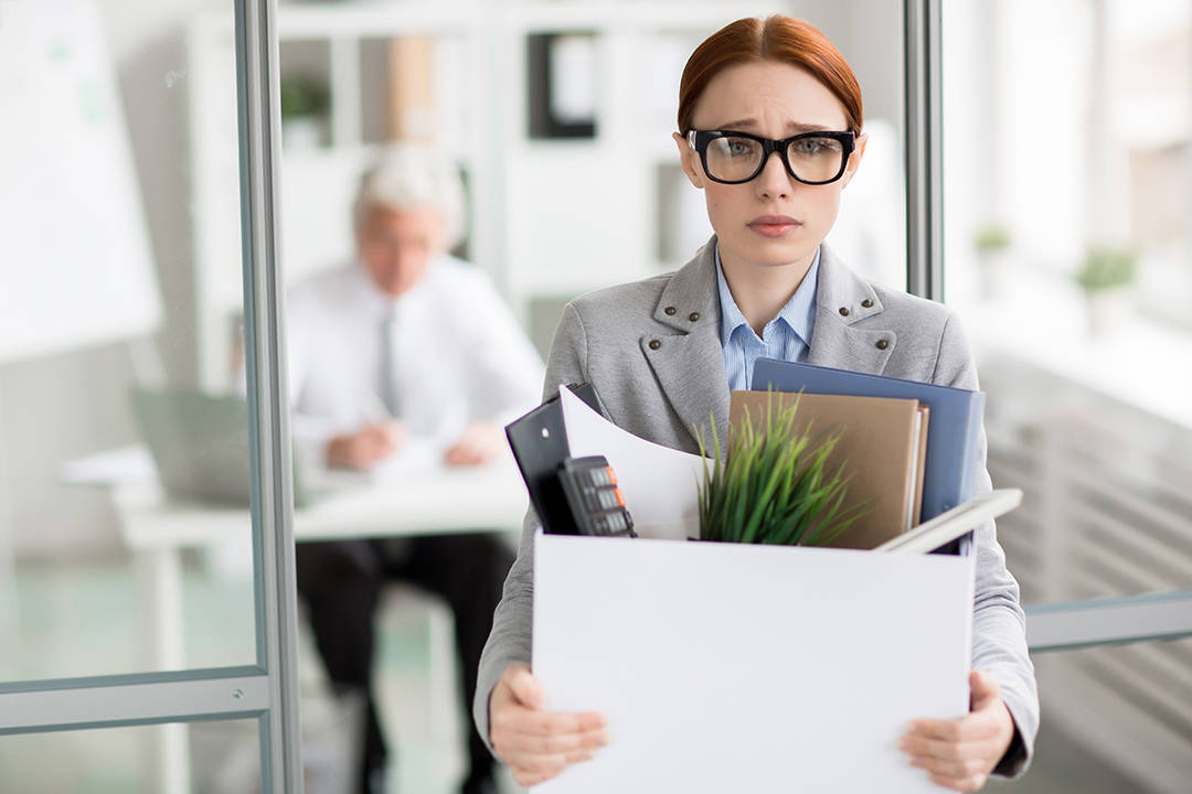 Employee Leaving Office With Belongings Background