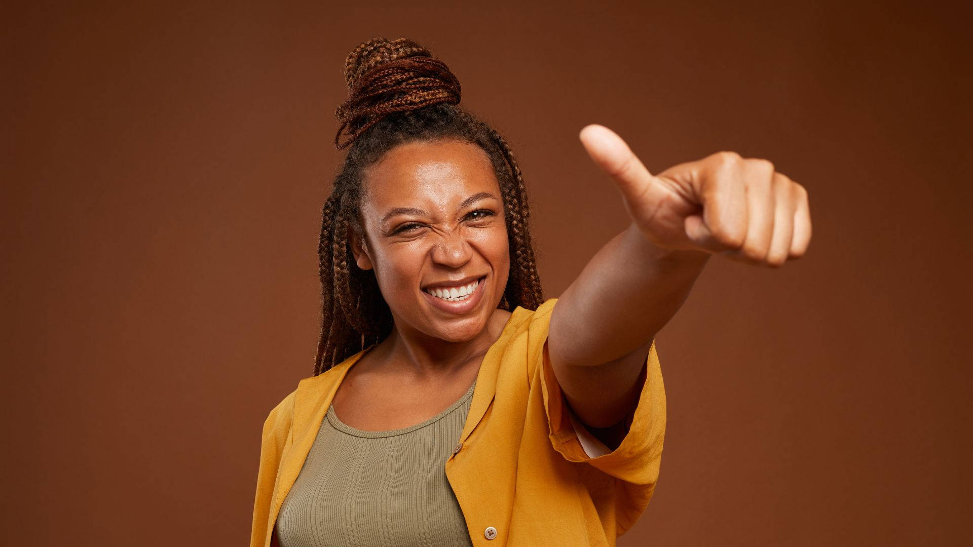 Empowered African Woman Giving Thumbs Up Background