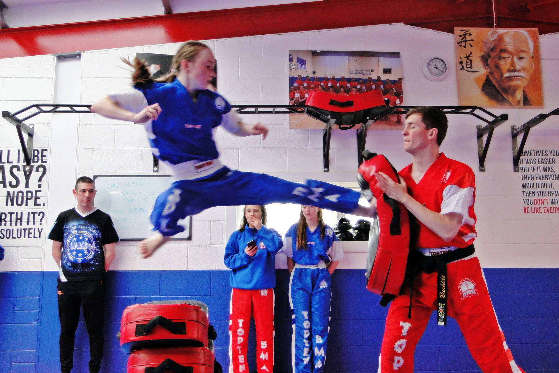 Empowered Woman During Intensive Kickboxing Training