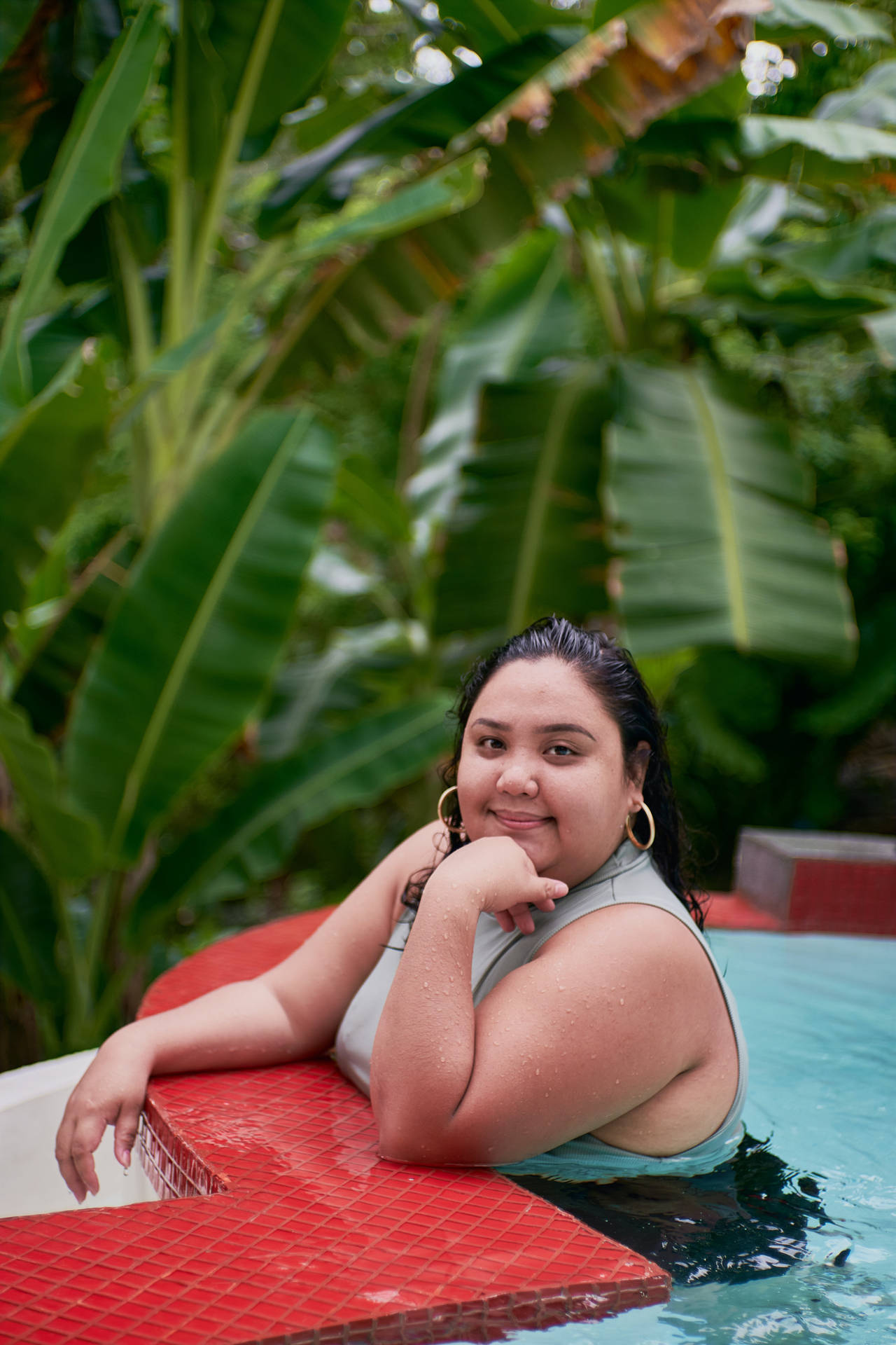 Empowering Confidence - Plus Size Woman Enjoying A Pool Day Background