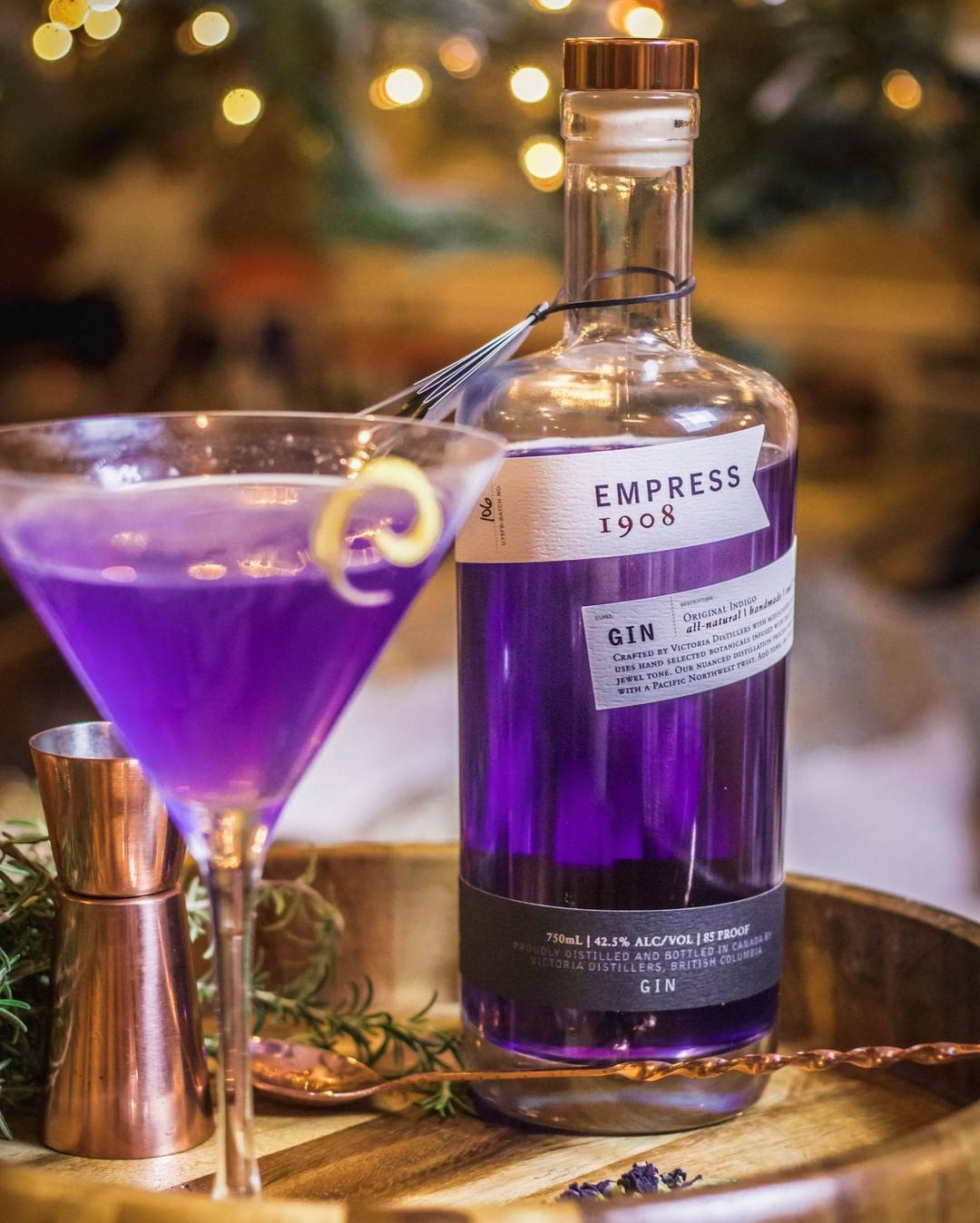 Empress 1908 Gin On A Rustic Wooden Bowl Background