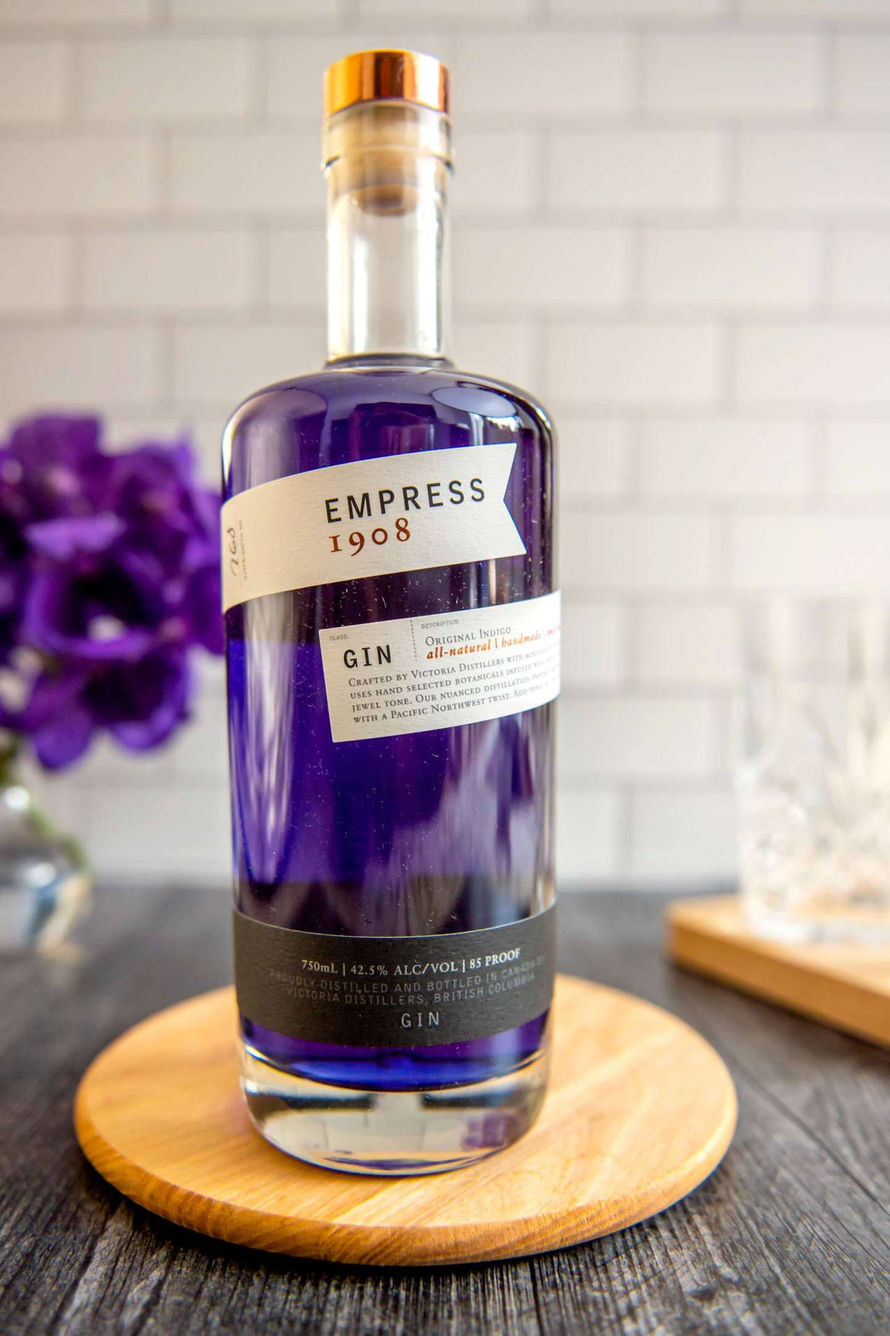 Empress Gin On Wooden Dish Plate Background