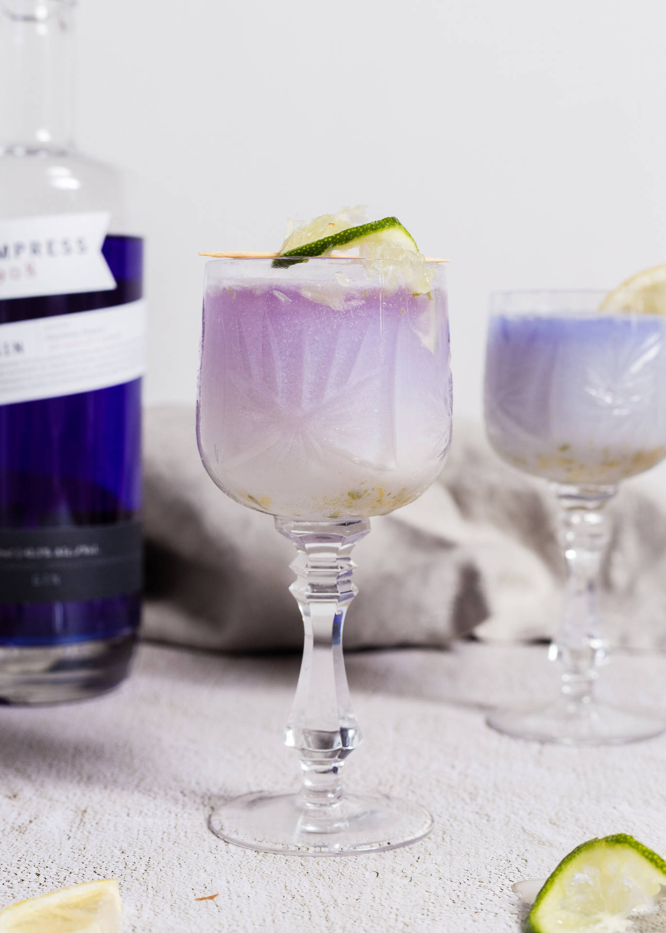 Empress Gin Paired With Fresh Flowers Craft Cocktail. Background