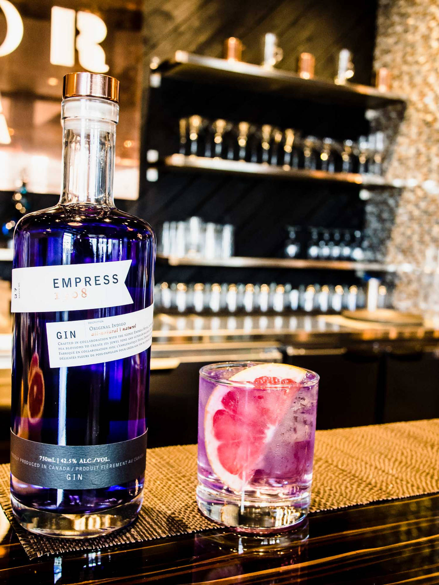 Empress Indigo Gin On Rocks Glass Background