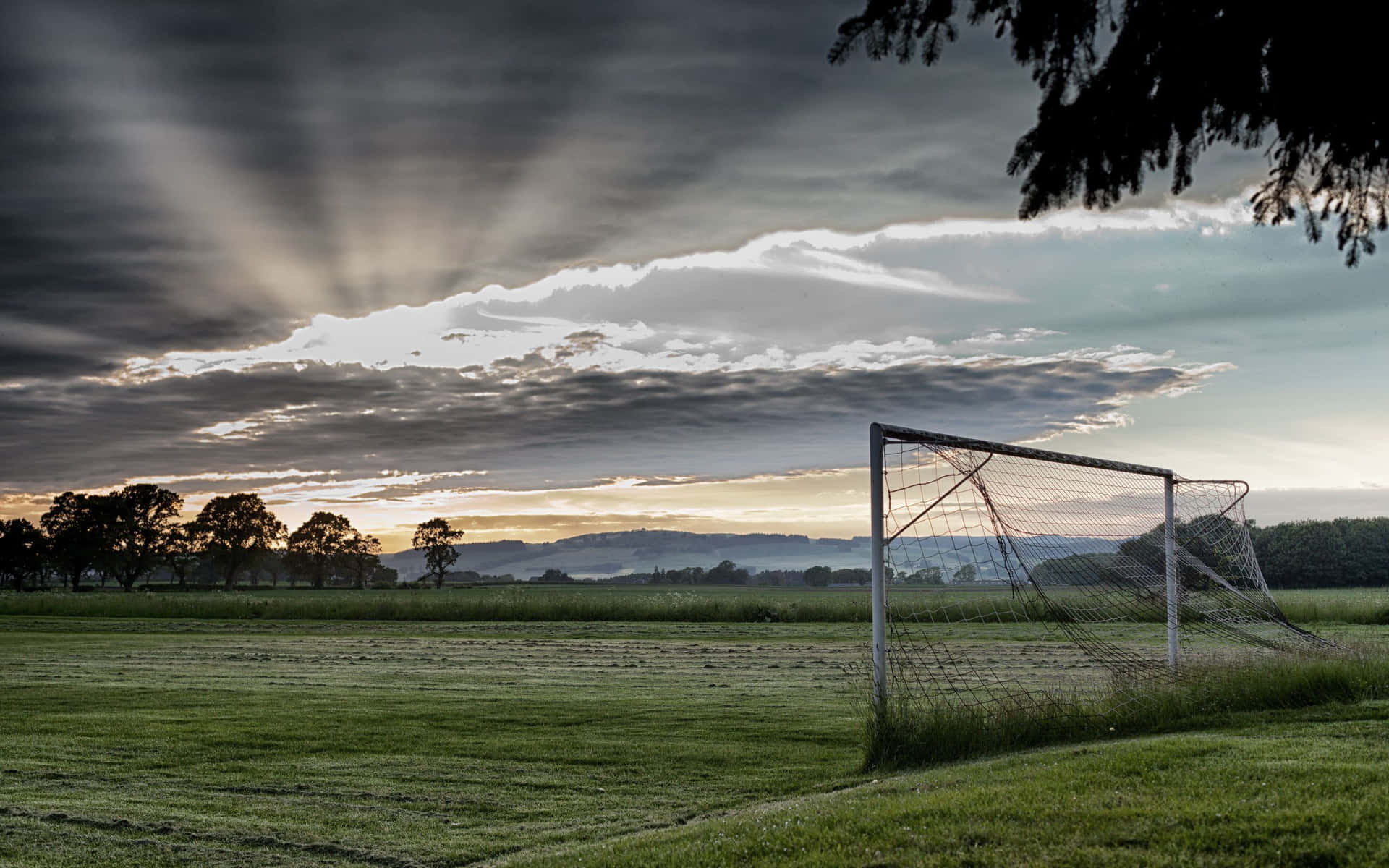 Empty Football Field With Gray Clouds Background