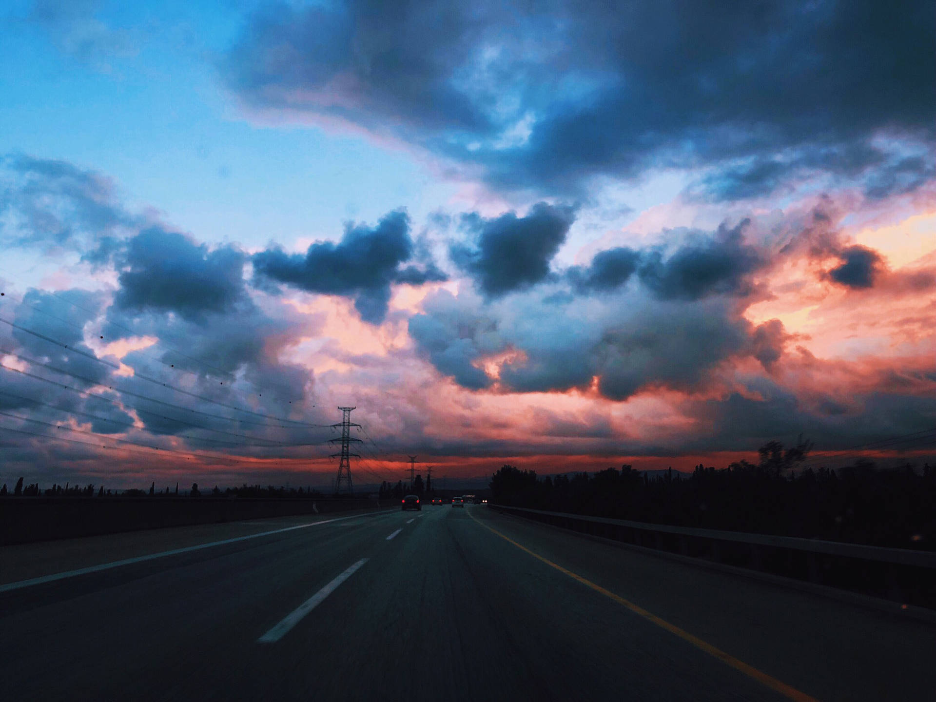 Empty Road With Dark Blue Clouds Background