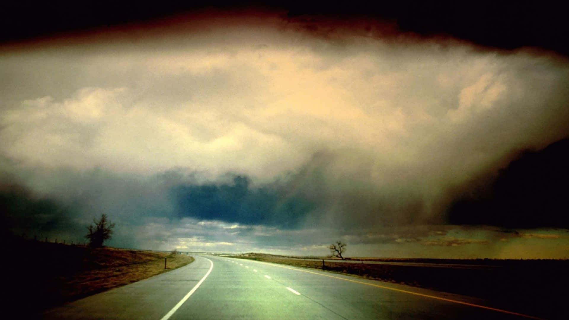 Empty Road With Storm Clouds Background