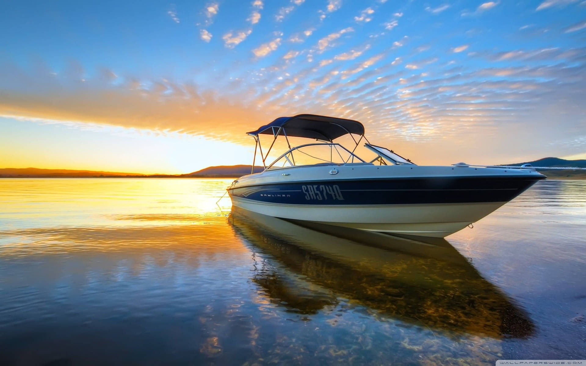 Empty Speed Boat Against Sunset Background